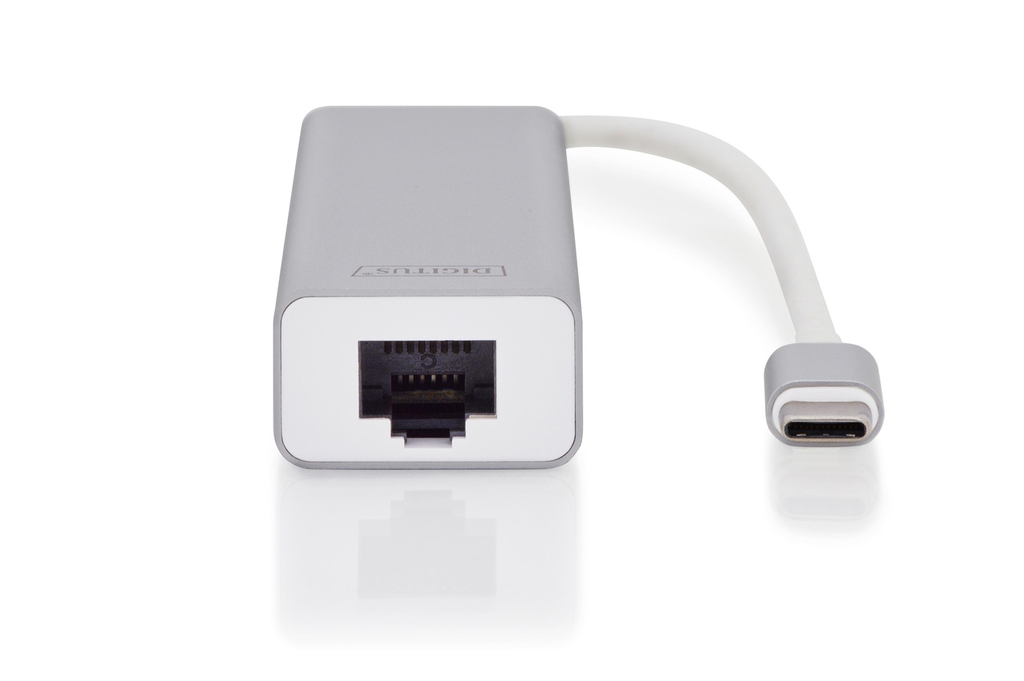 Ein silberner Ethernet-Adapter mit einem USB-C-Anschluss. Der Adapter befindet sich auf einer weißen Oberfläche.