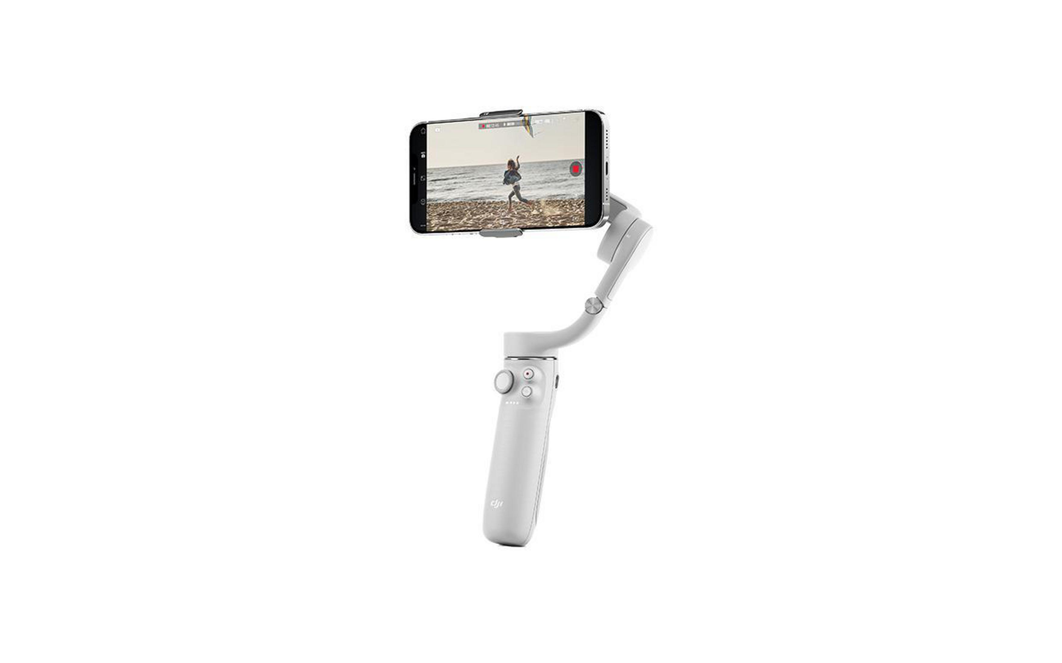 Weißes Gimbal, das ein Telefon hält und eine Person am Strand zeigt.