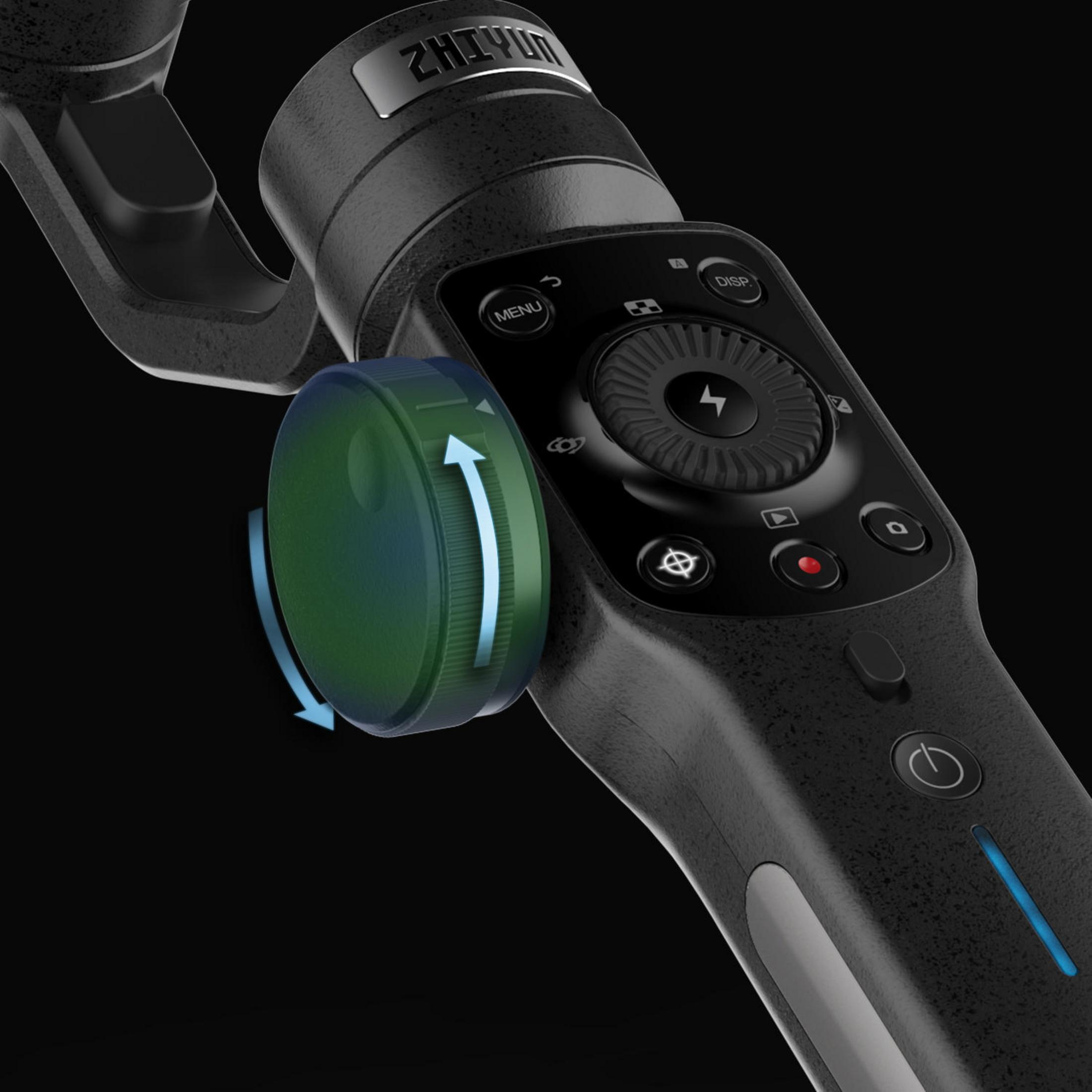 Nahaufnahme eines Hand-Gimbals mit einem Einstellrad. Das Rad ist grün, das Gerät schwarz.