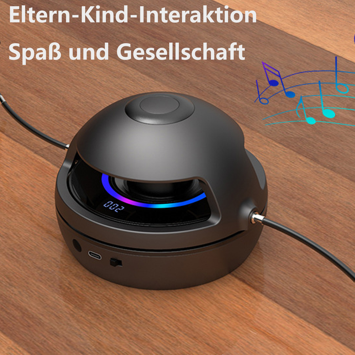 Ein schwarzer Lautsprecher mit Lichtring und Knöpfen steht auf einer Holzoberfläche.