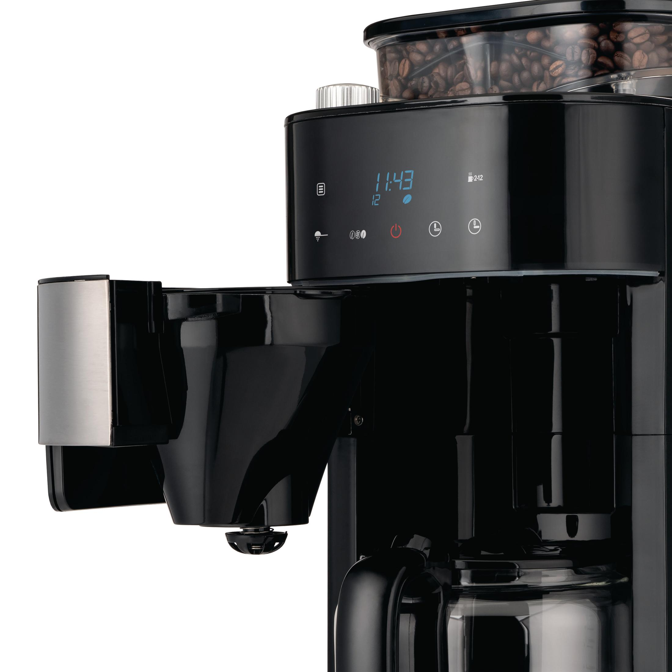 Czarny ekspres do kawy z cyfrowym wyświetlaczem i szklaną karafką. To zdjęcie zbliżeniowe.