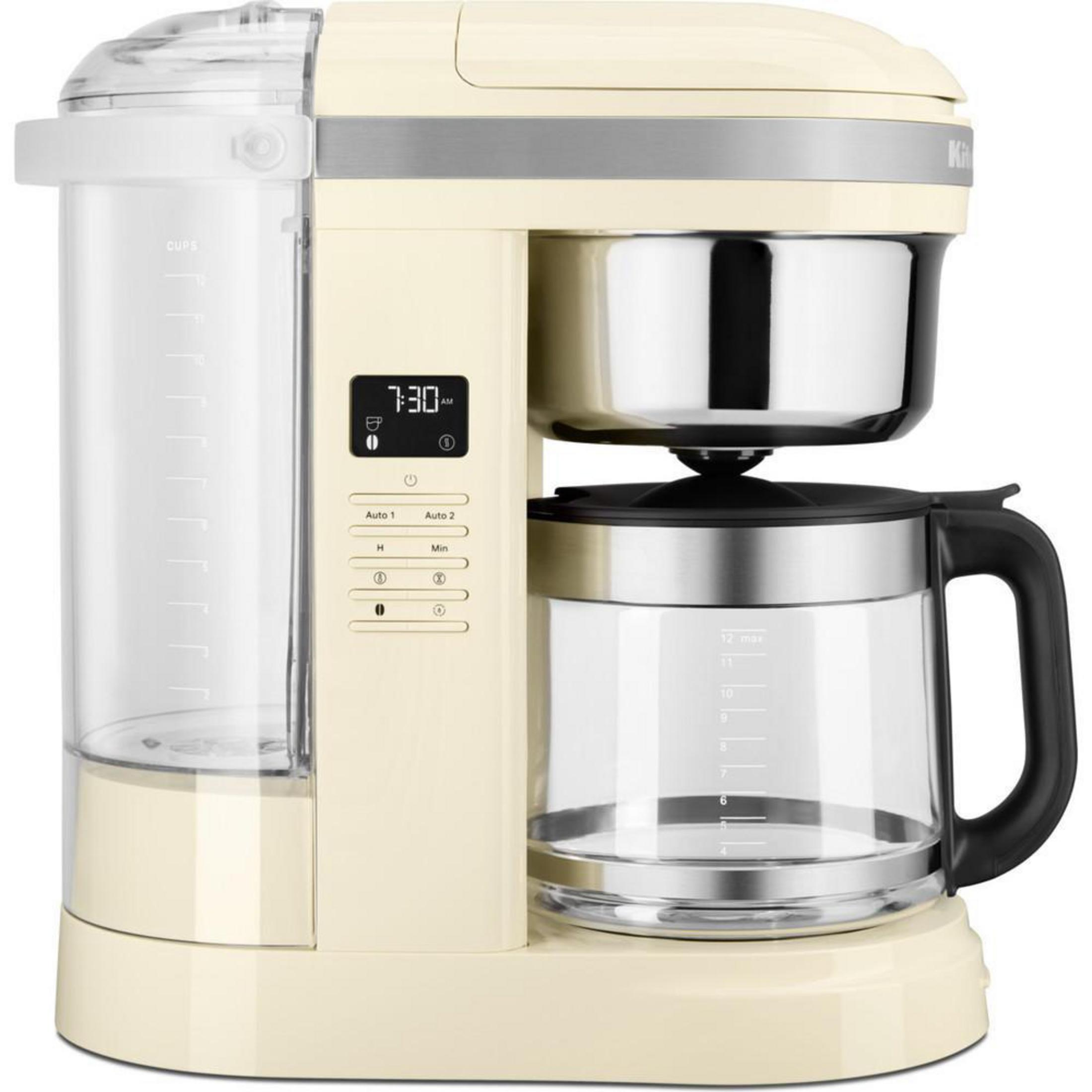 Cremefarbene Kaffeemaschine mit Digitalanzeige.