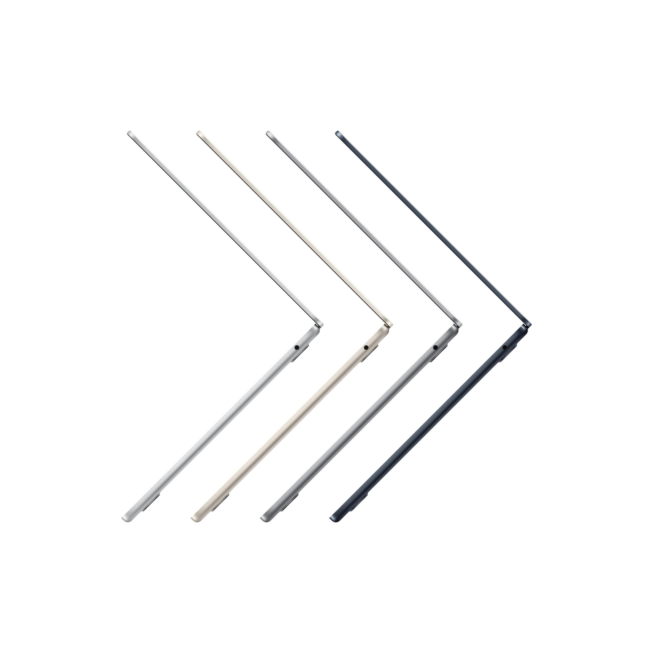 Vier Laptops in einer Reihe, Seitenansicht, verschiedene Farben. Alle Bildschirme sind geschlossen.