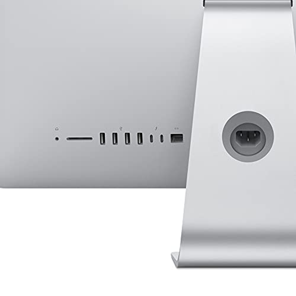 Die Rückseite eines silbernen iMac-Computers mit verschiedenen Anschlüssen und einem Ständer.