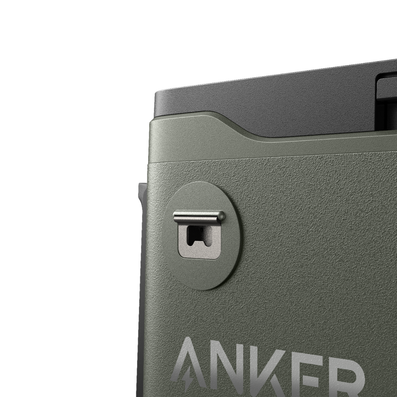 Anker-Logo auf grüner Oberfläche. Metallring auf einer runden Form.
