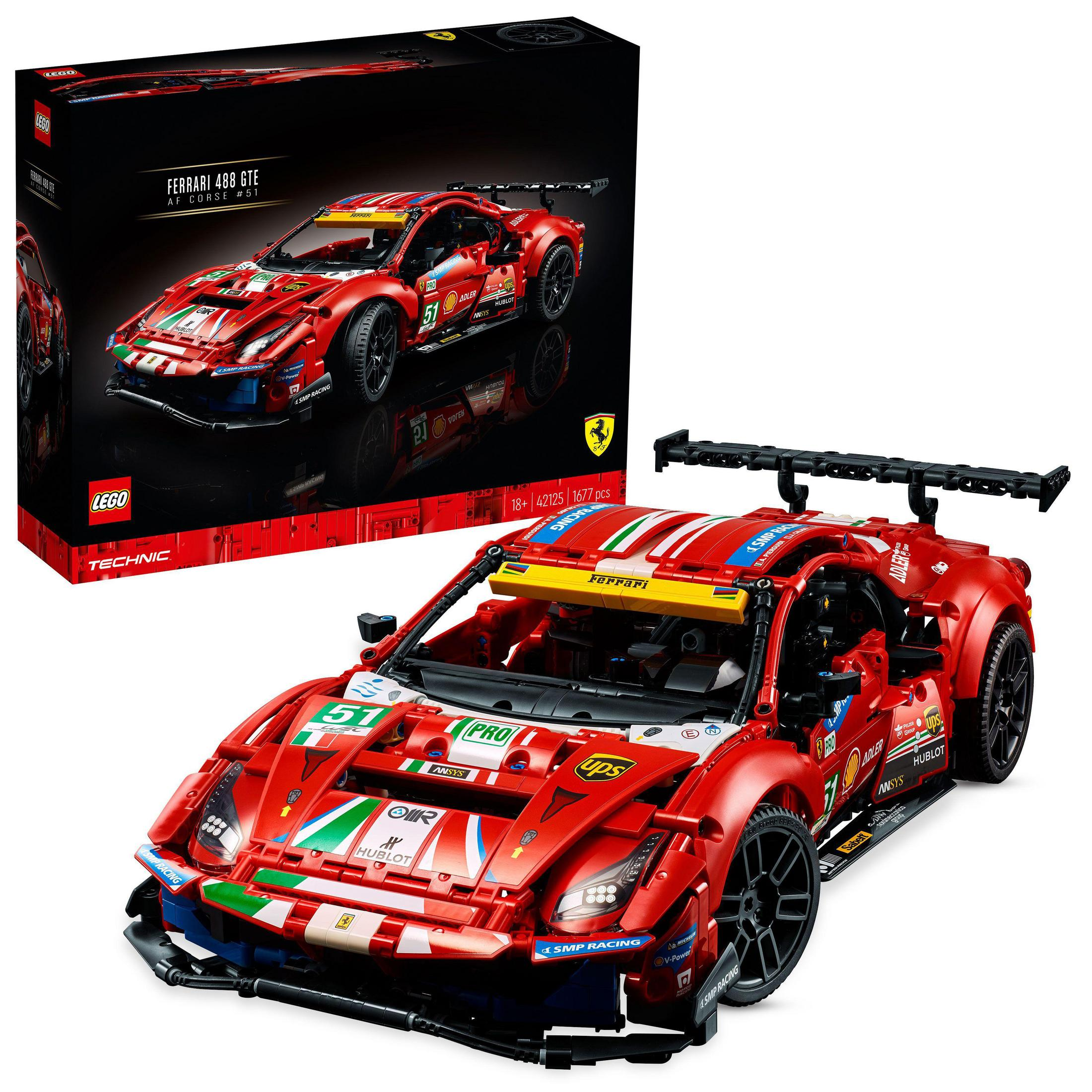Rotes Lego Ferrari Rennwagenmodell mit Box im Hintergrund.