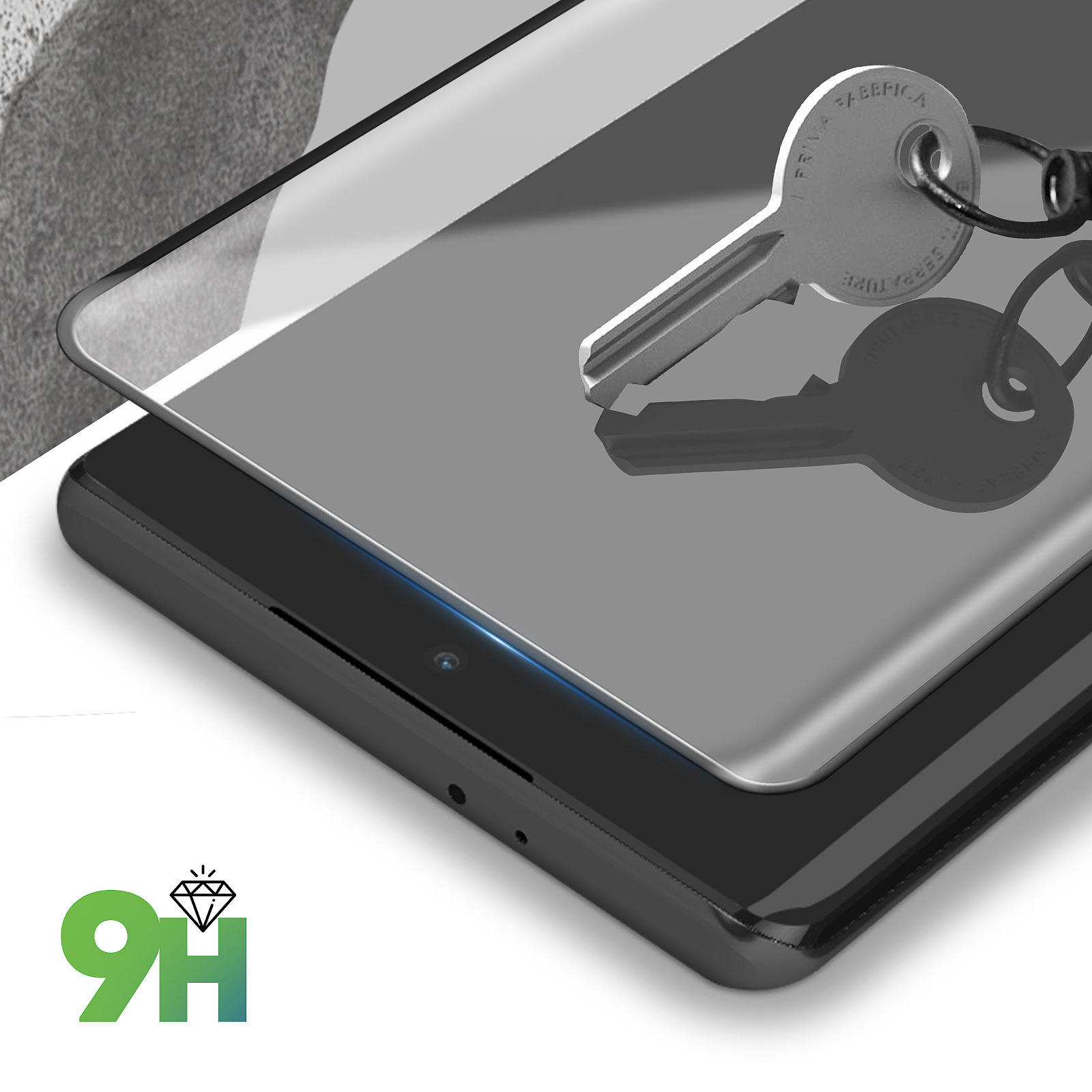 Un téléphone avec un protecteur d'écran et des clés dessus. Le protecteur est transparent.