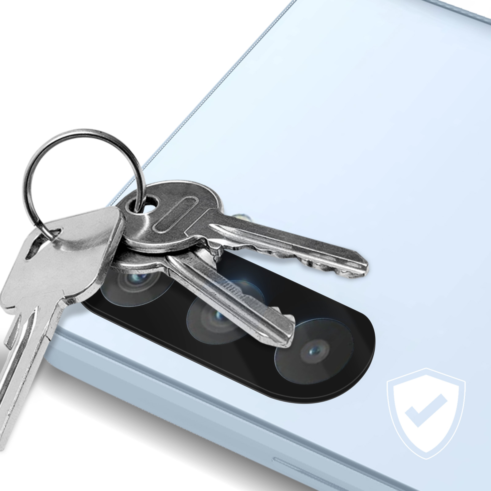 Des clés sont placées sur la caméra d'un téléphone bleu clair. Une icône de bouclier est dans le coin.
