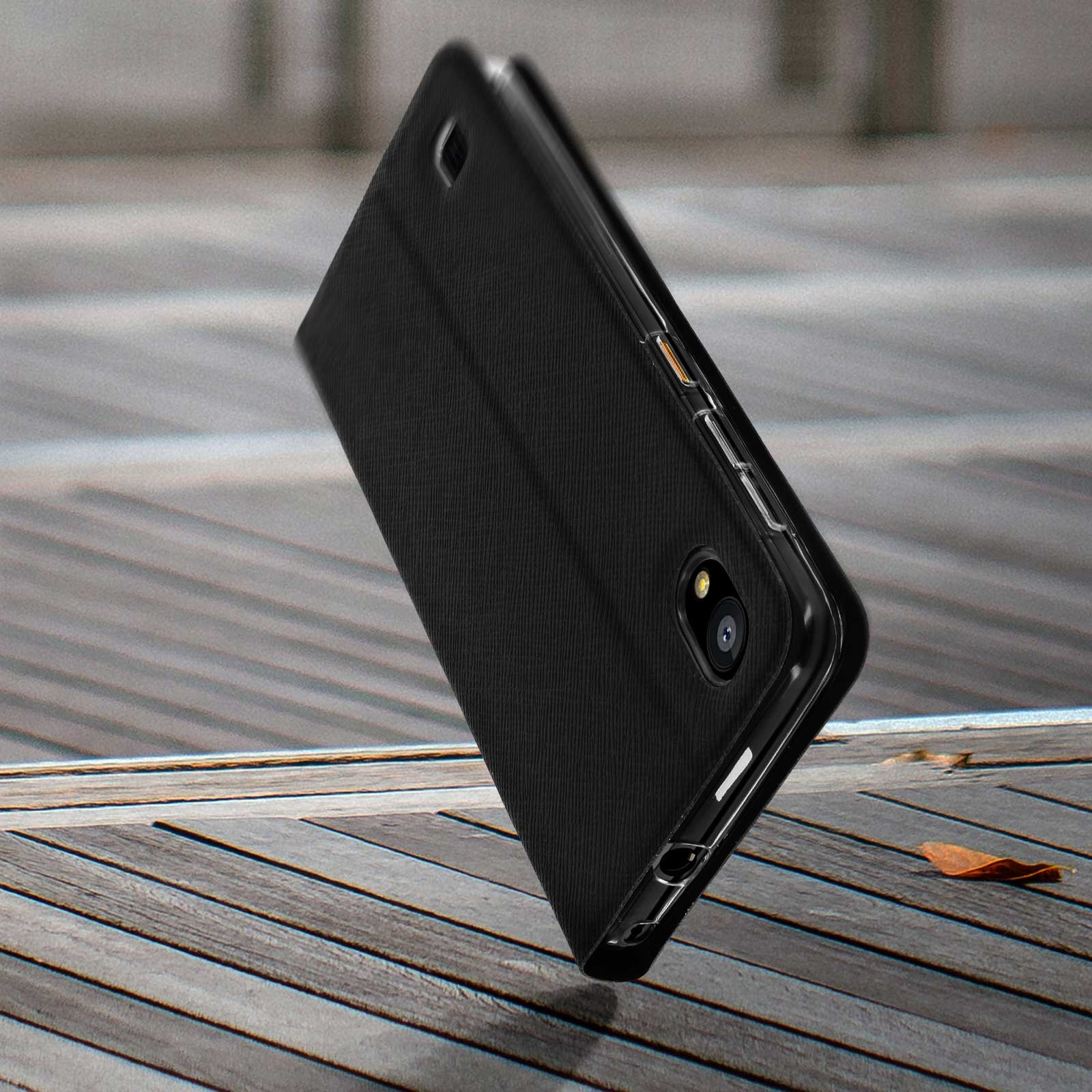 Una custodia per telefono nera con un telefono all'interno, posizionata su una superficie di legno.