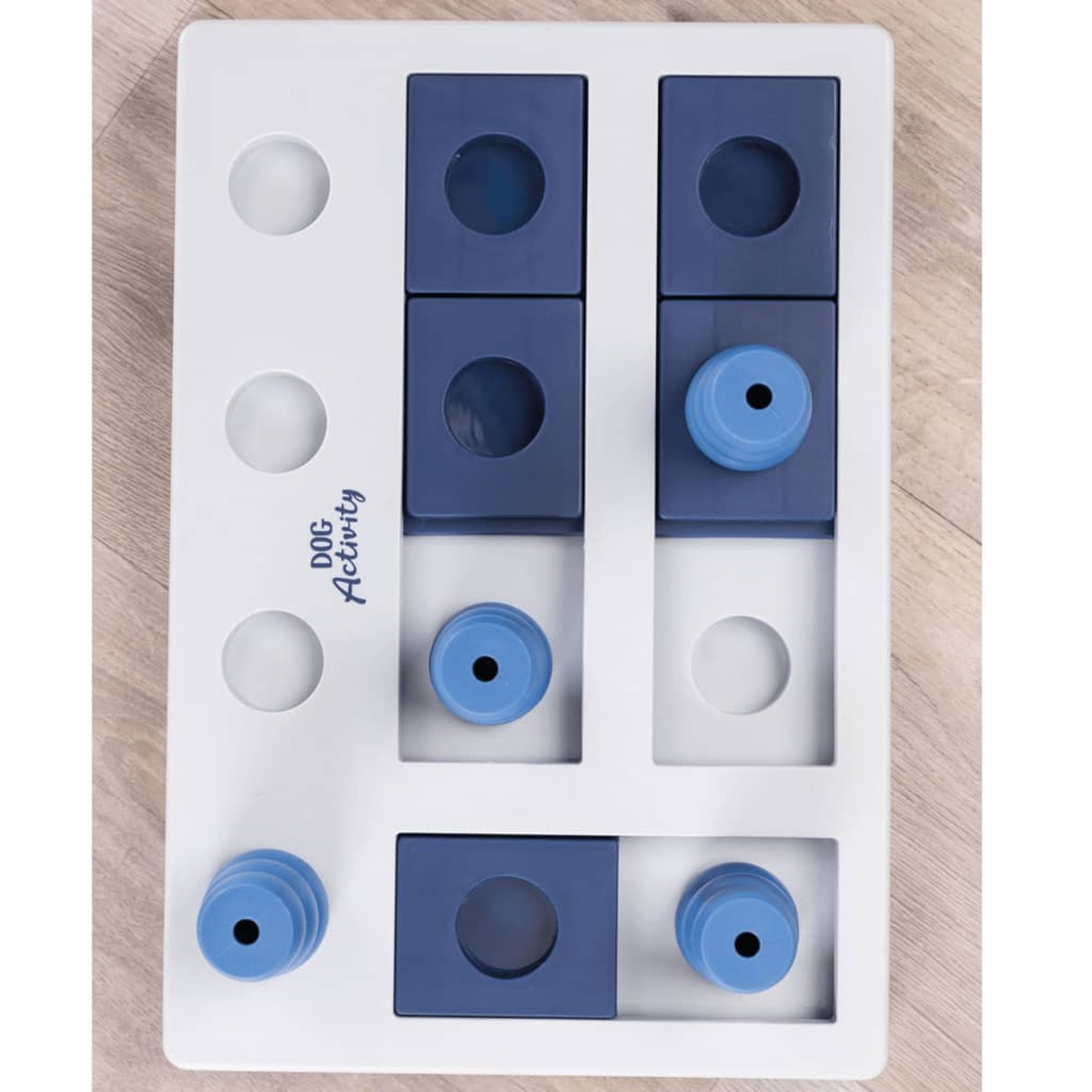 Giocattolo puzzle per cani con blocchi scorrevoli e scomparti. Colori bianco e blu. Dog Activity.