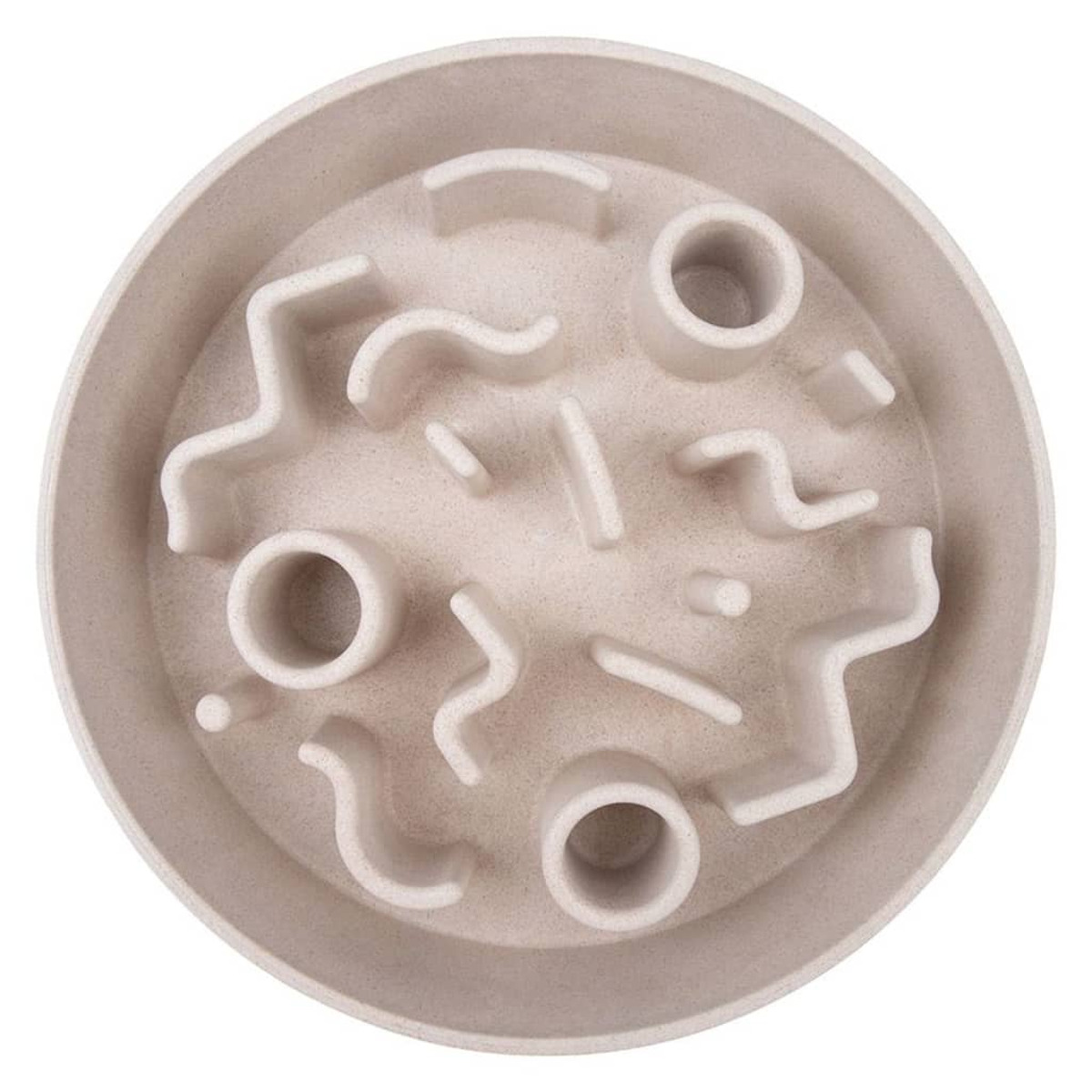 Eine hellfarbene Hundenapf mit einem komplizierten Labyrinth-Design im Inneren. Die Schüssel ist leer.