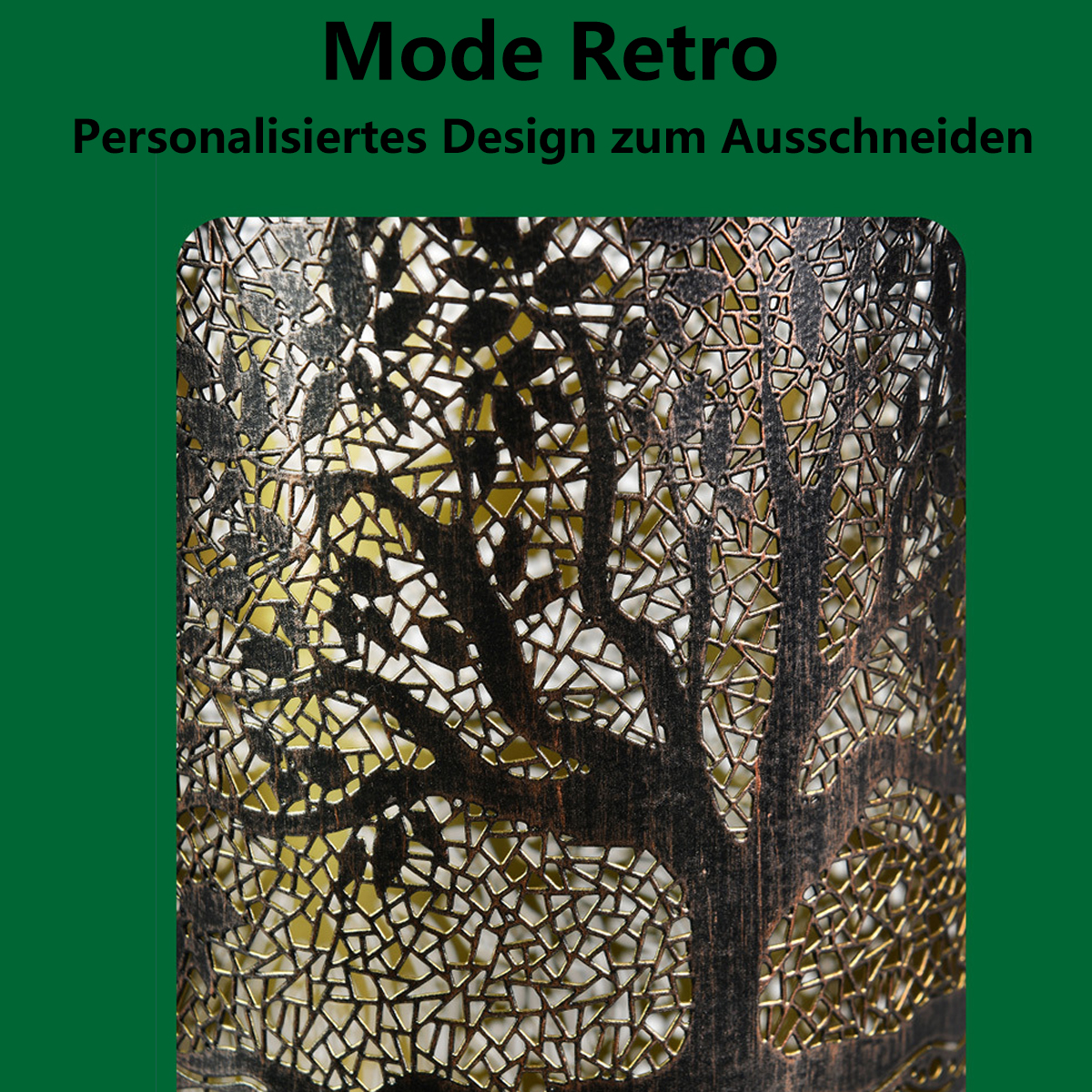 Eine dekorative Lampe mit einem Baum-Silhouette-Design, vor grünem Hintergrund.