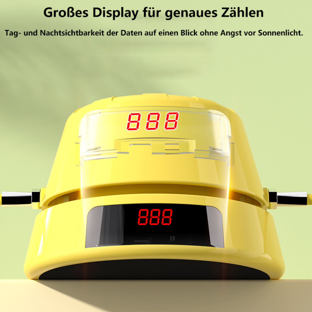 Gelbes digitales Springseil mit Anzeige 888, vor verschwommenem grünem Hintergrund.