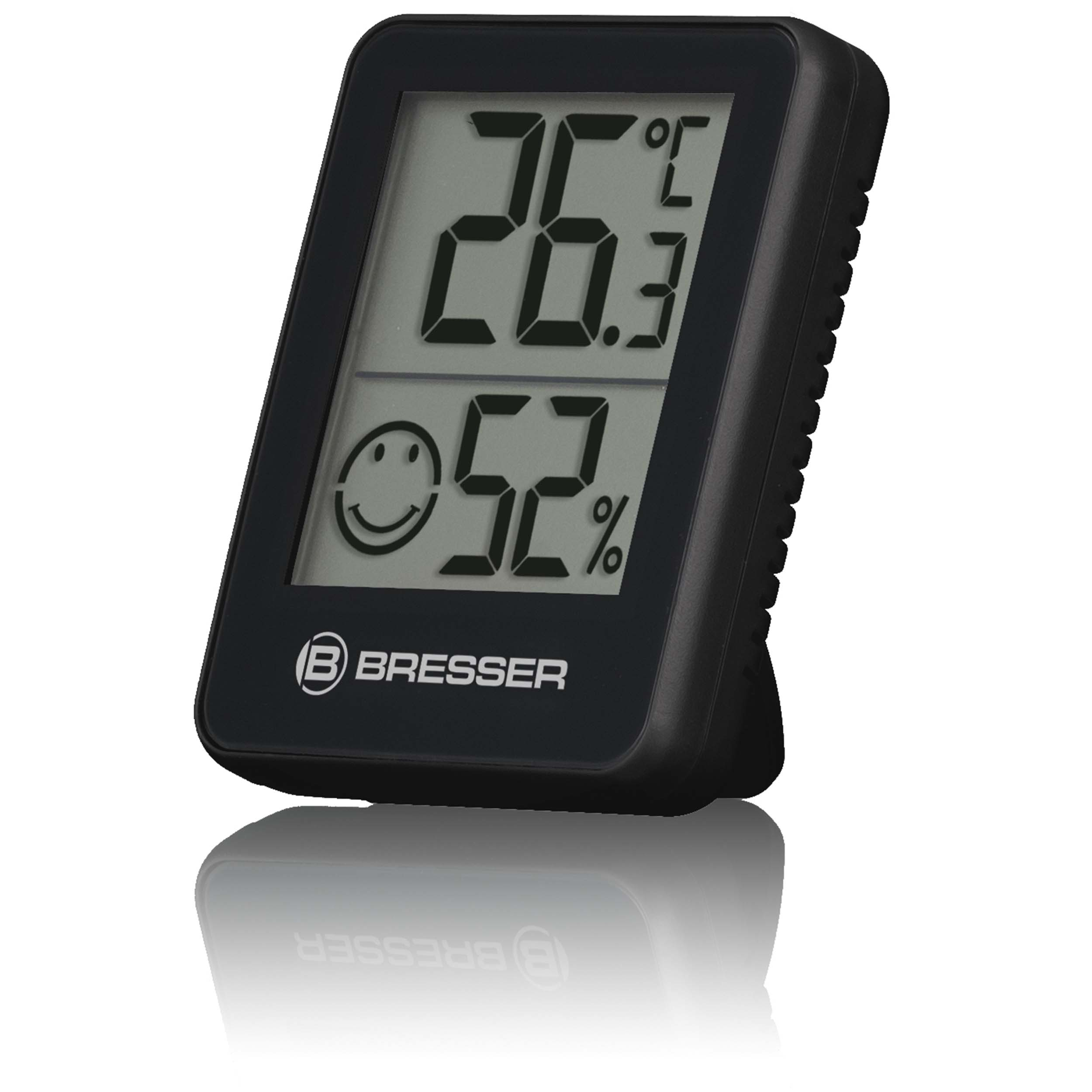 Un termómetro digital negro muestra 26.3°C y 52% con un icono de carita sonriente.