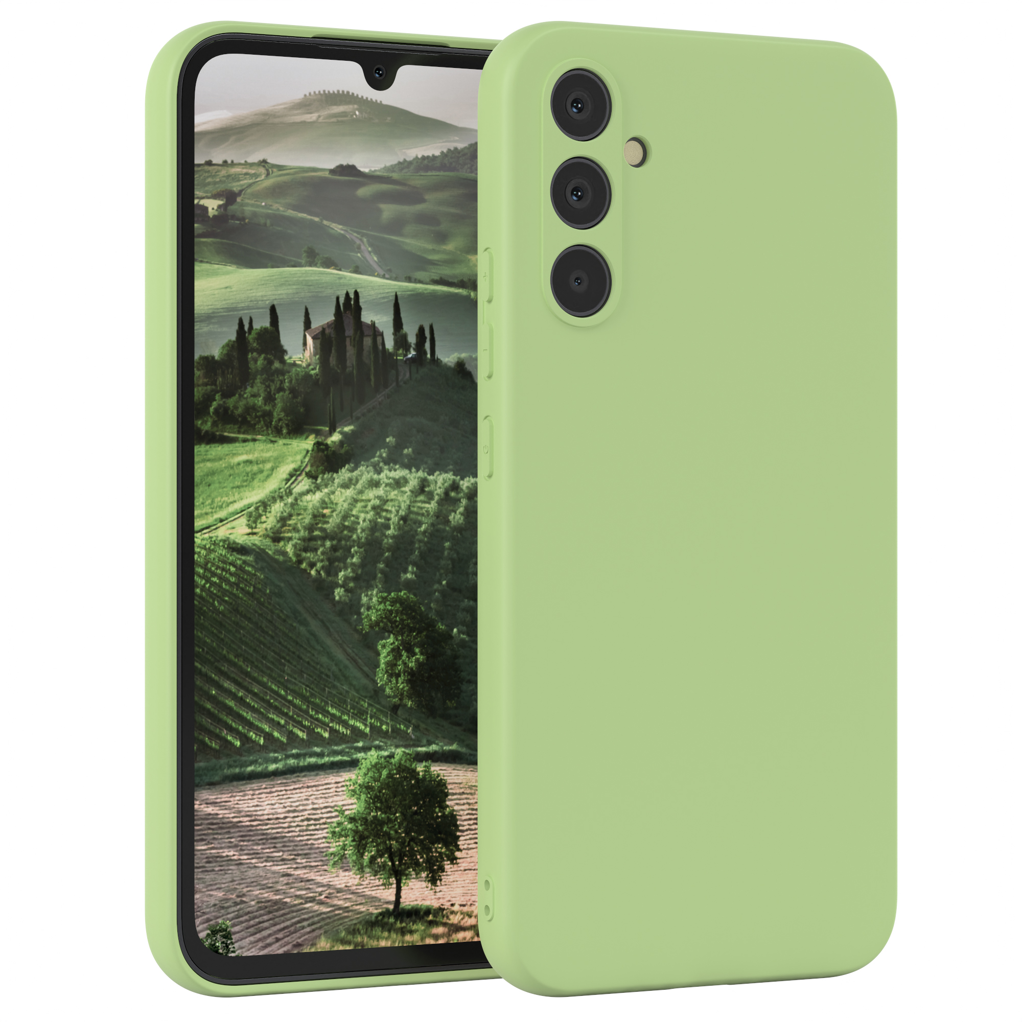 Grüne Handyhülle neben einem Handy, das eine Landschaft mit einer Kirche zeigt.