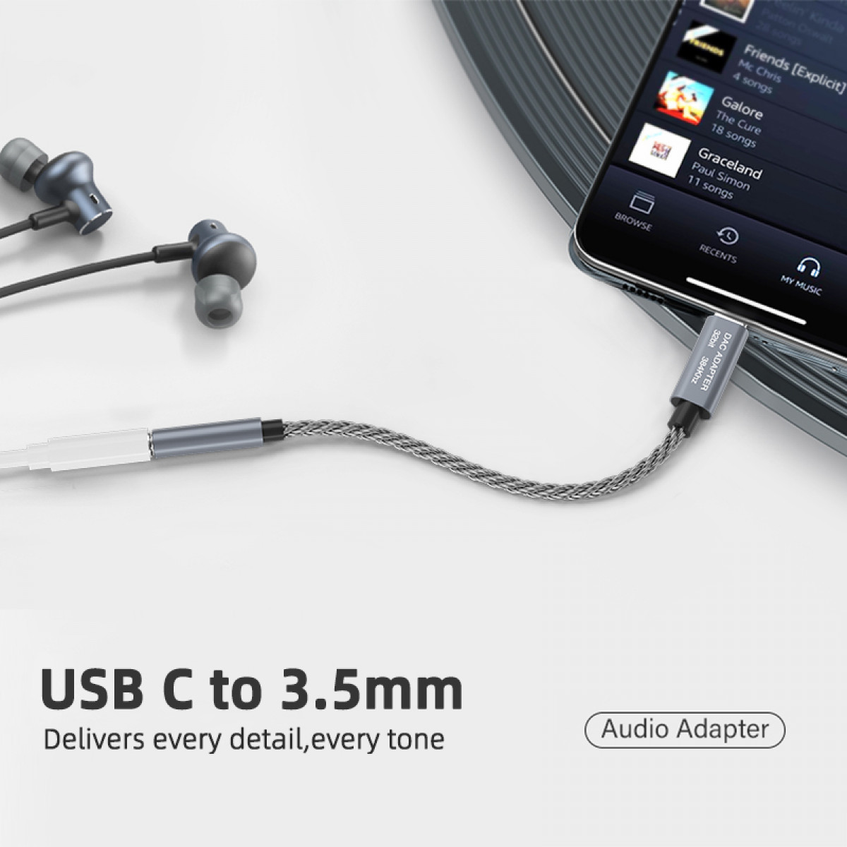 Adapter audio USB-C do 3,5 mm ze słuchawkami i telefonem odtwarzającym muzykę.
