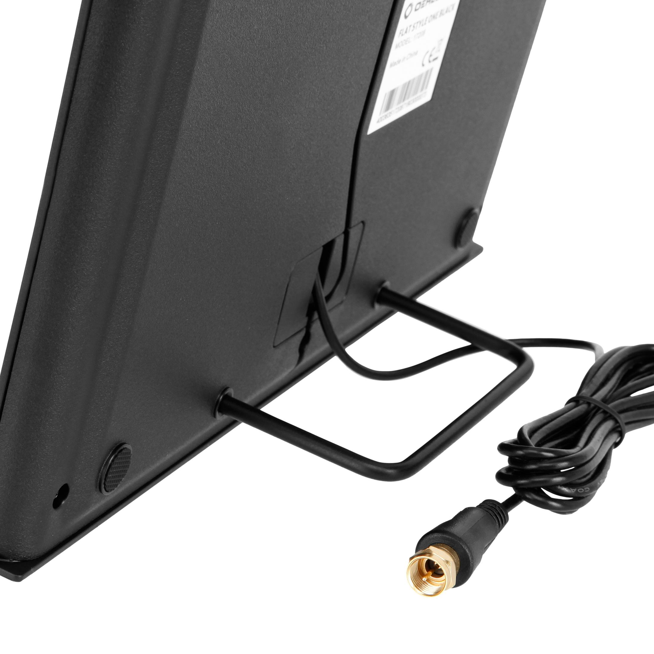 Tył czarnego urządzenia z wpiętym kablem, widok z bliskiej odległości.