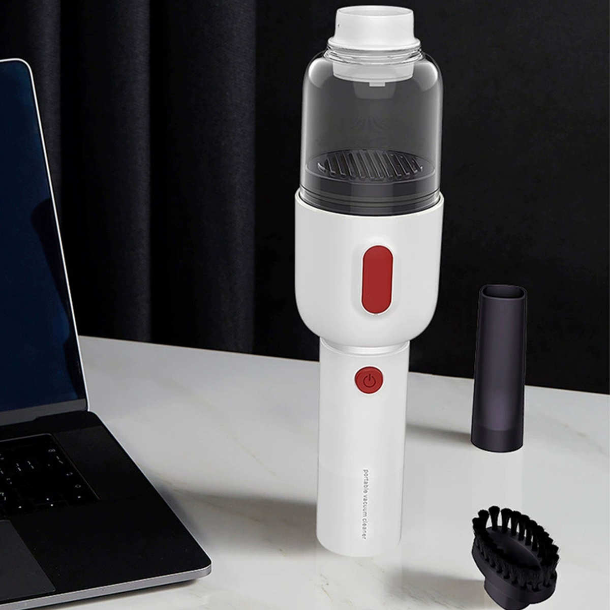 Biały i czarny przenośny odkurzacz z akcesoriami.