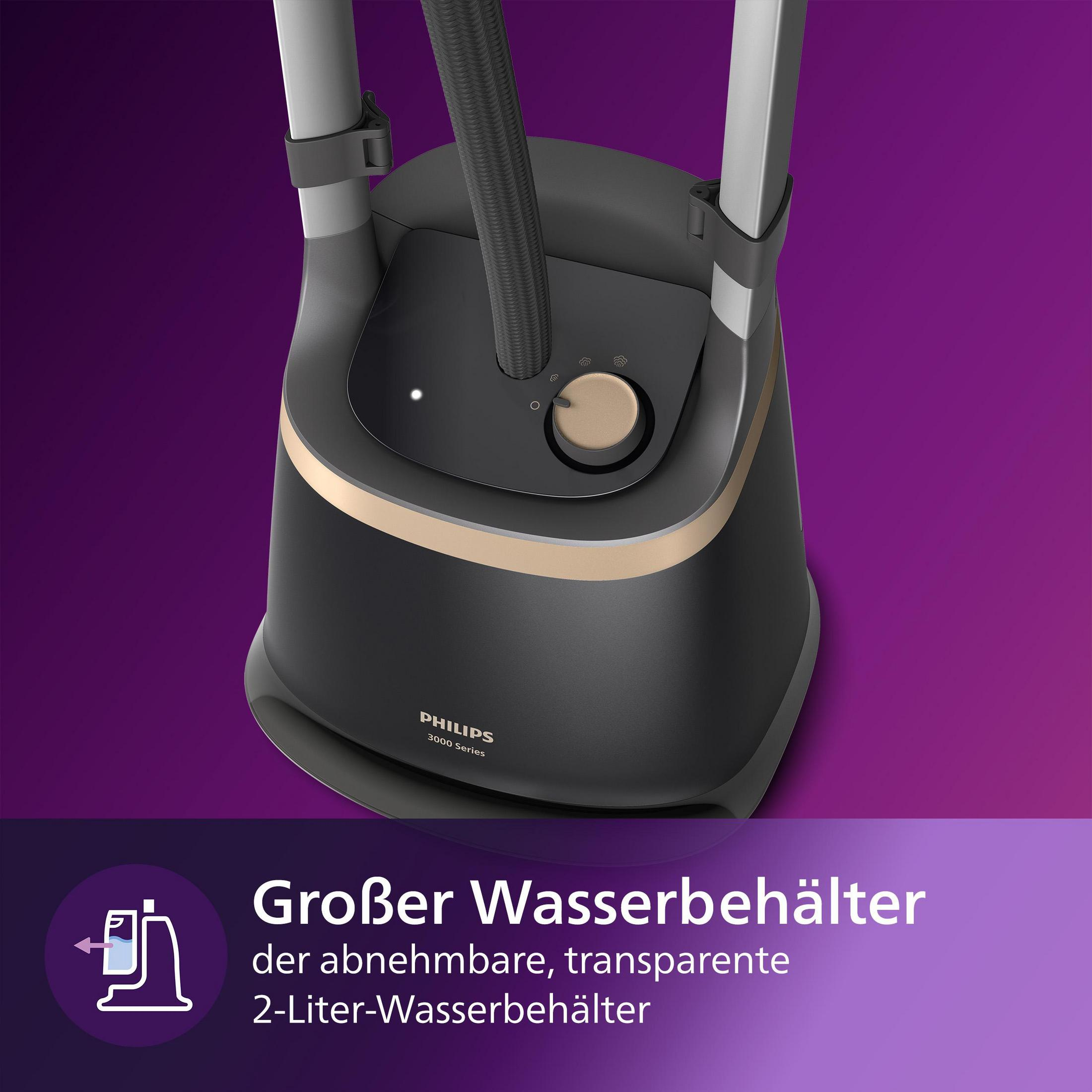 A black and gold garment steamer with a water reservoir.