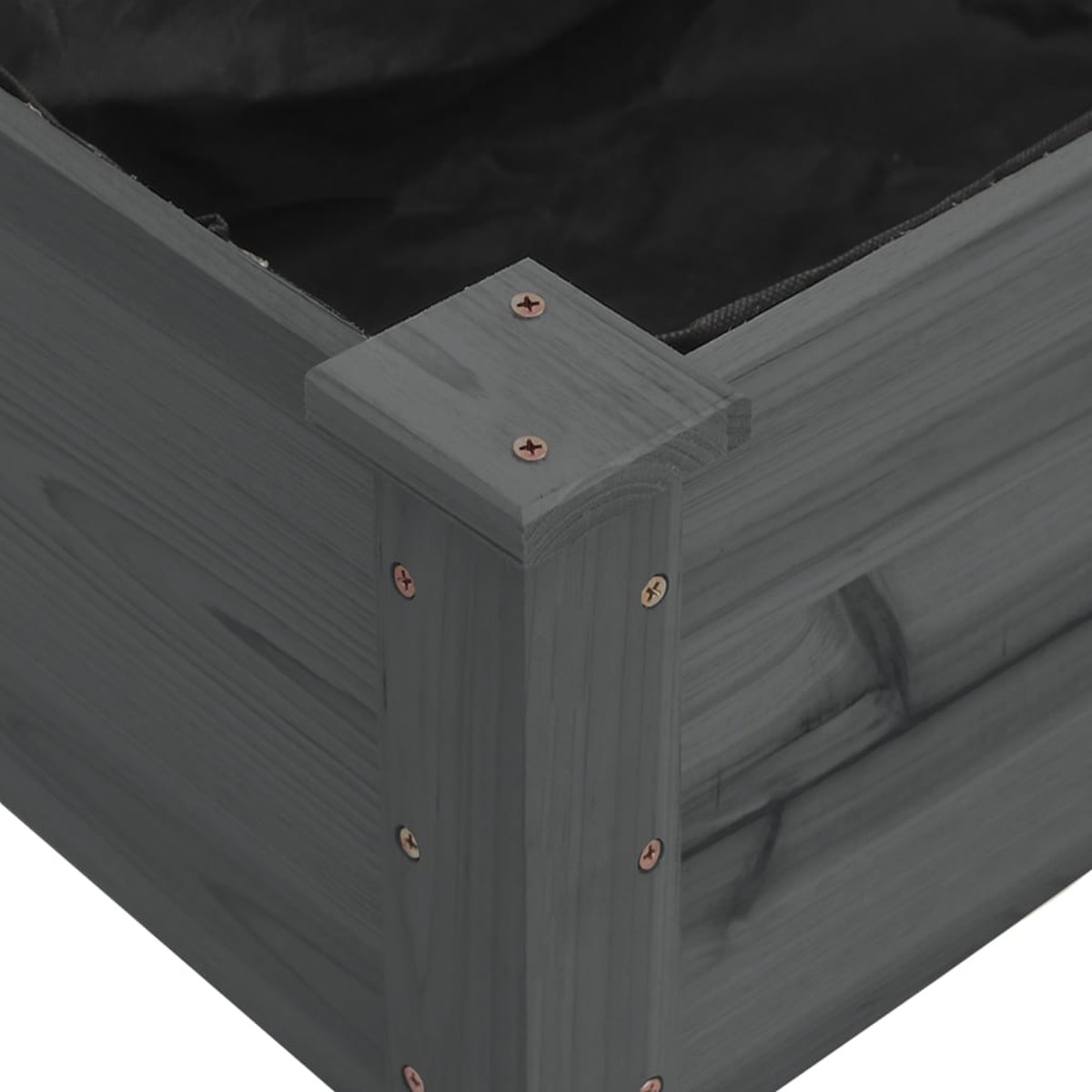 Nahaufnahme einer Ecke eines dunkelgrauen, erhöhten Holzbeets.