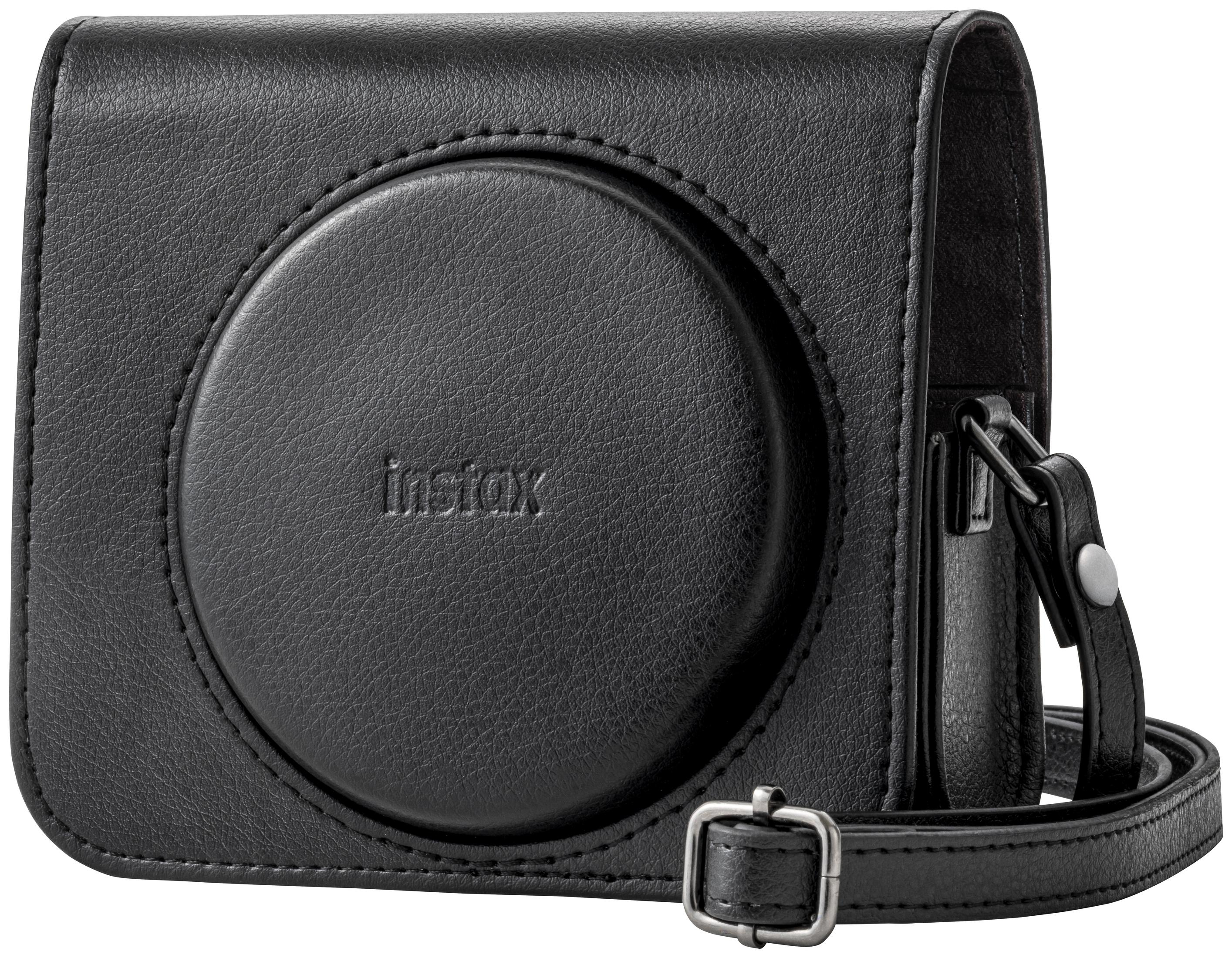 Zwarte Instax camerahoes met een cirkelvormige lensopening en schouderriem. Leren textuur zichtbaar.
