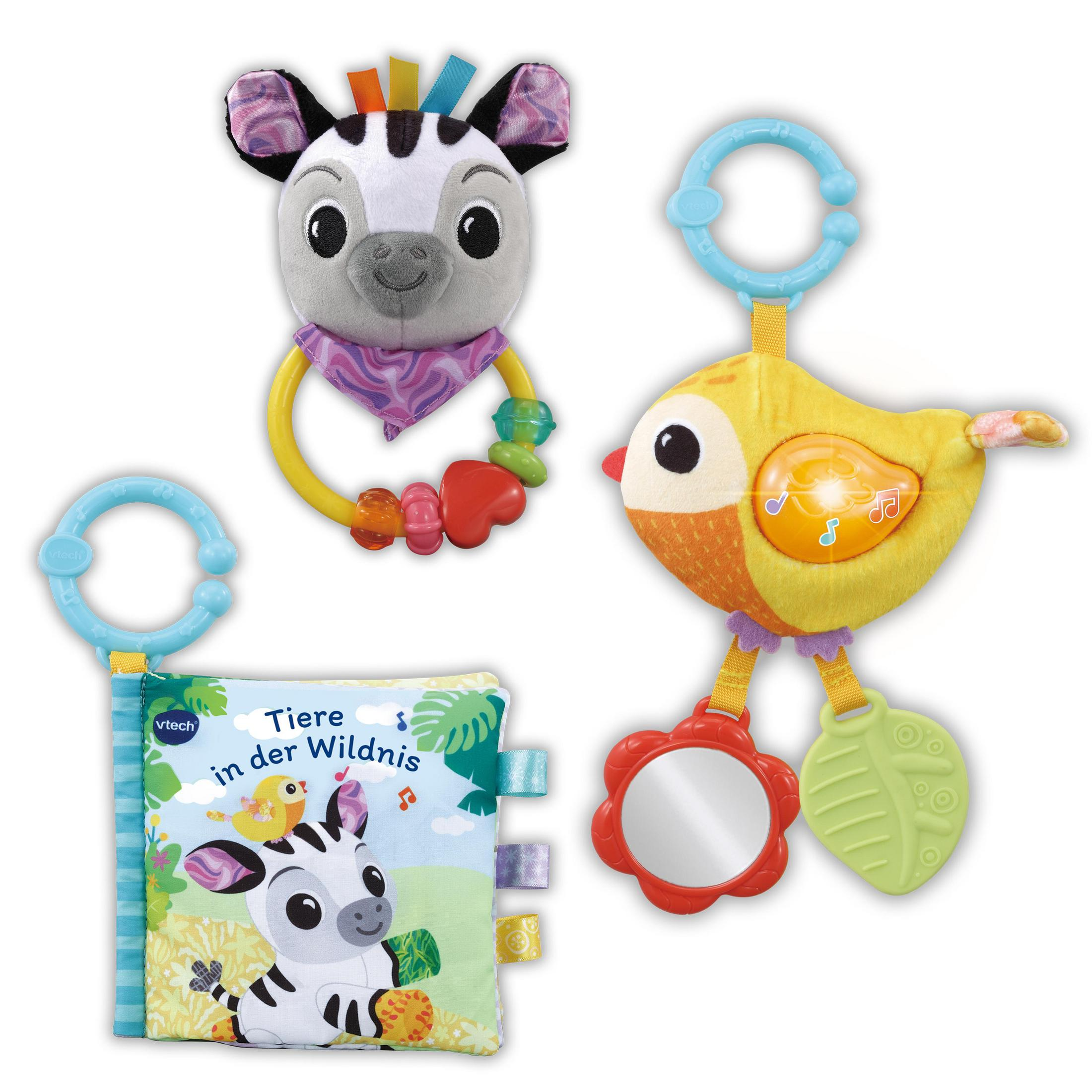 Drei Babyspielzeuge: ein Zebra-Rassel, ein Vogel mit Spiegel und ein Buch über Tiere.
