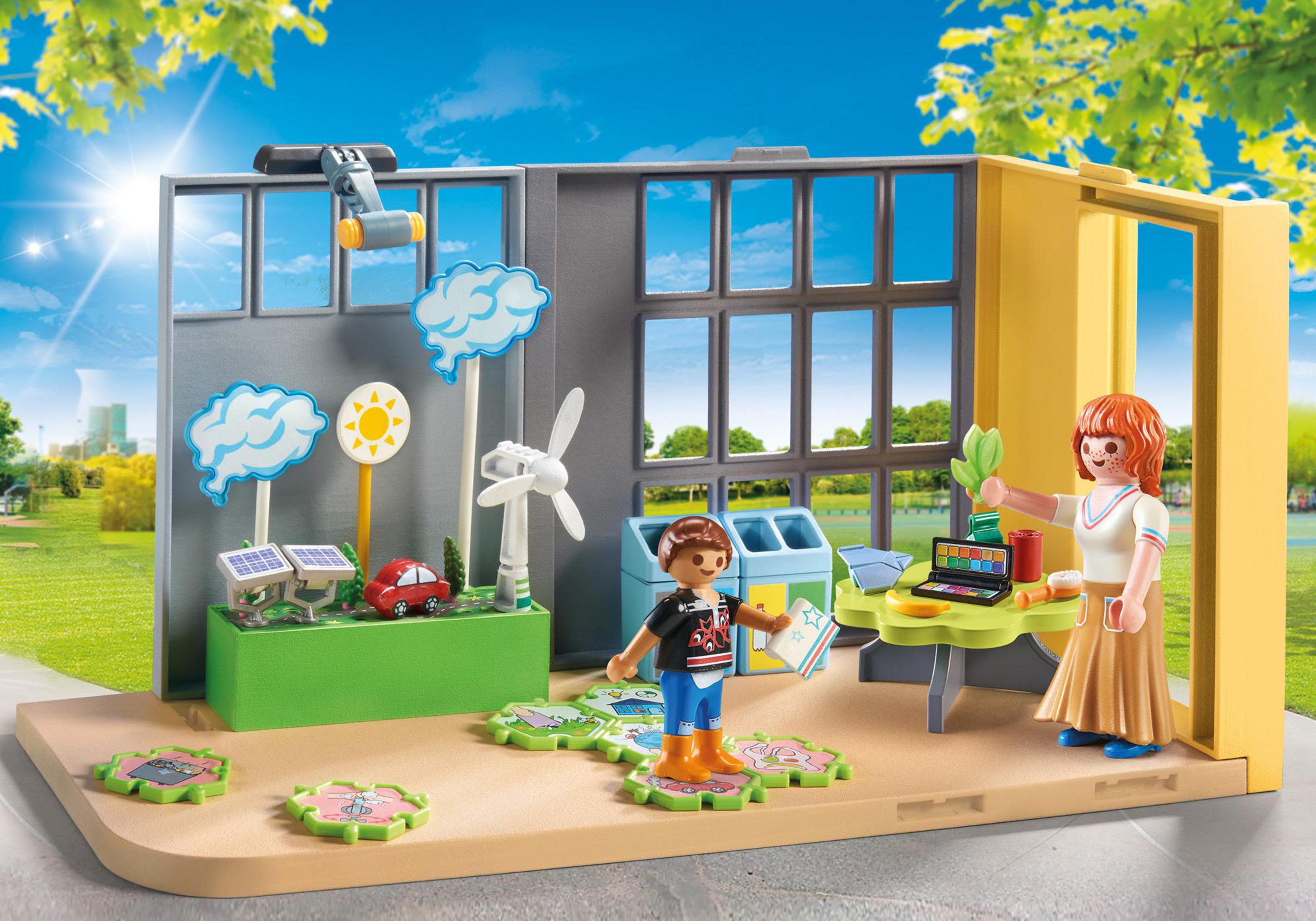 A Playmobil playset scene with a teacher and a boy in a classroom with eco-friendly items.