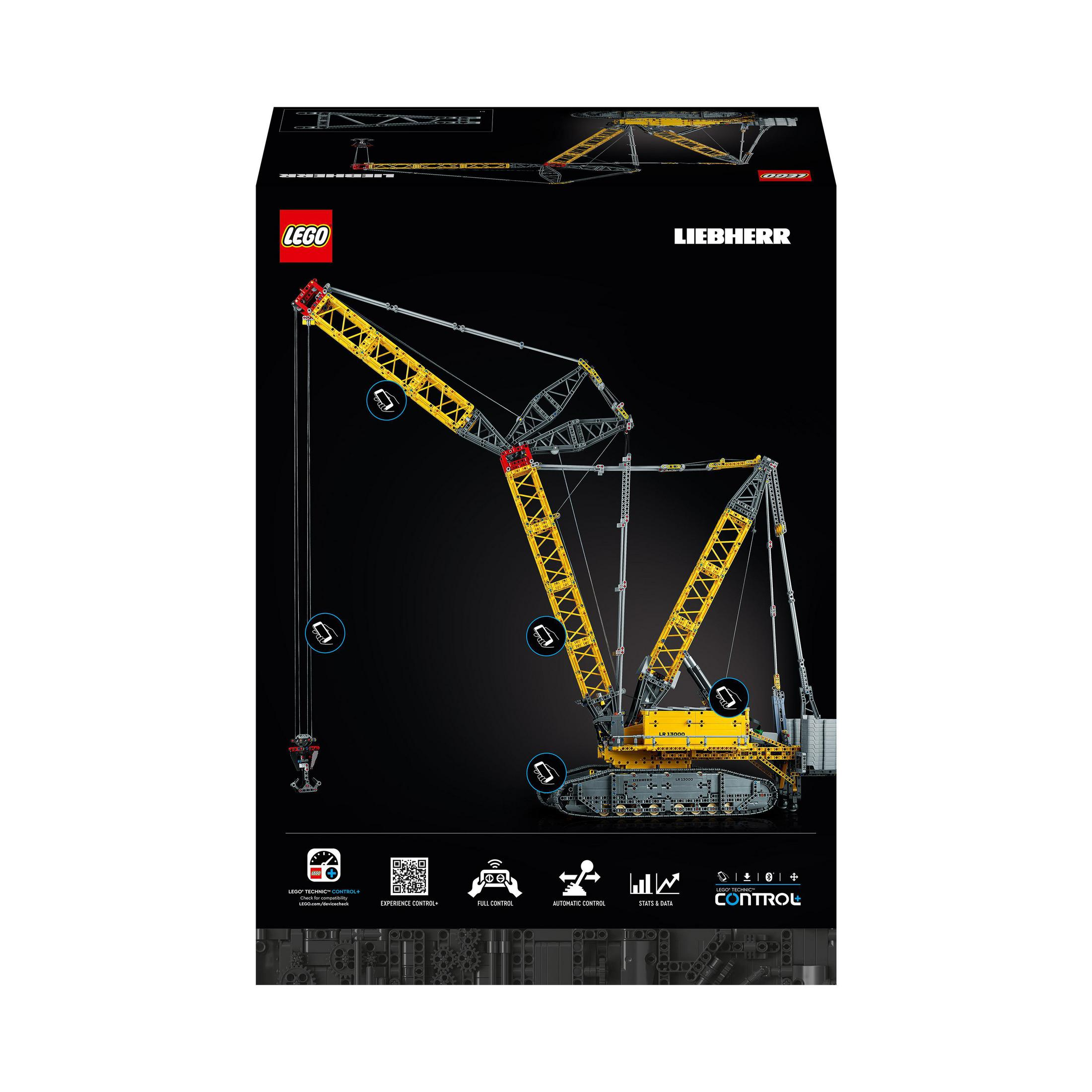 Pudełko z żurawiem Lego Liebherr. Żuraw żółty i czerwony na czarnym tle z logo i ikonami sterowania.