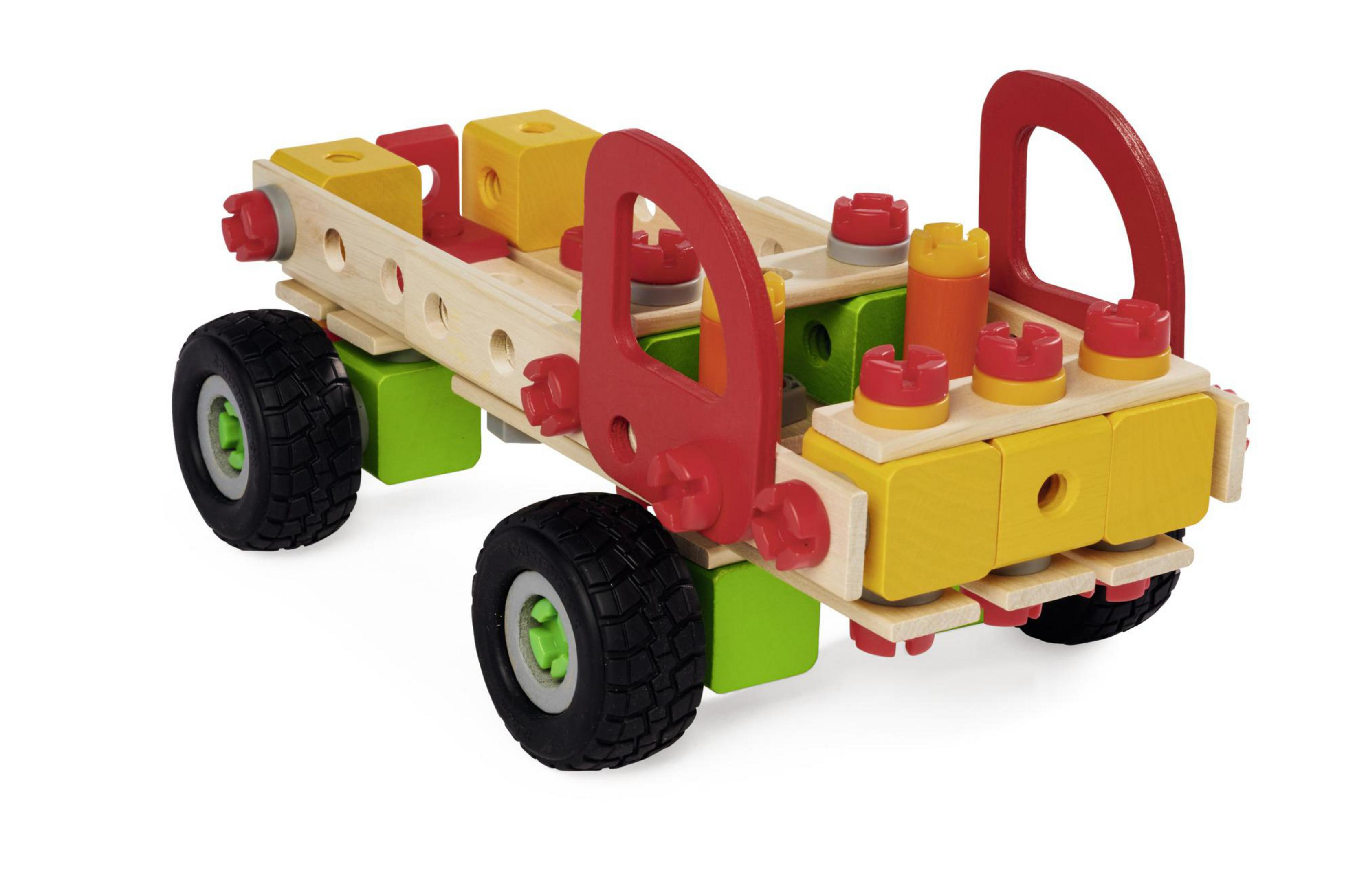 Holzspielzeug-LKW aus farbigen Blöcken. Er hat Räder und ein rotes Führerhaus.