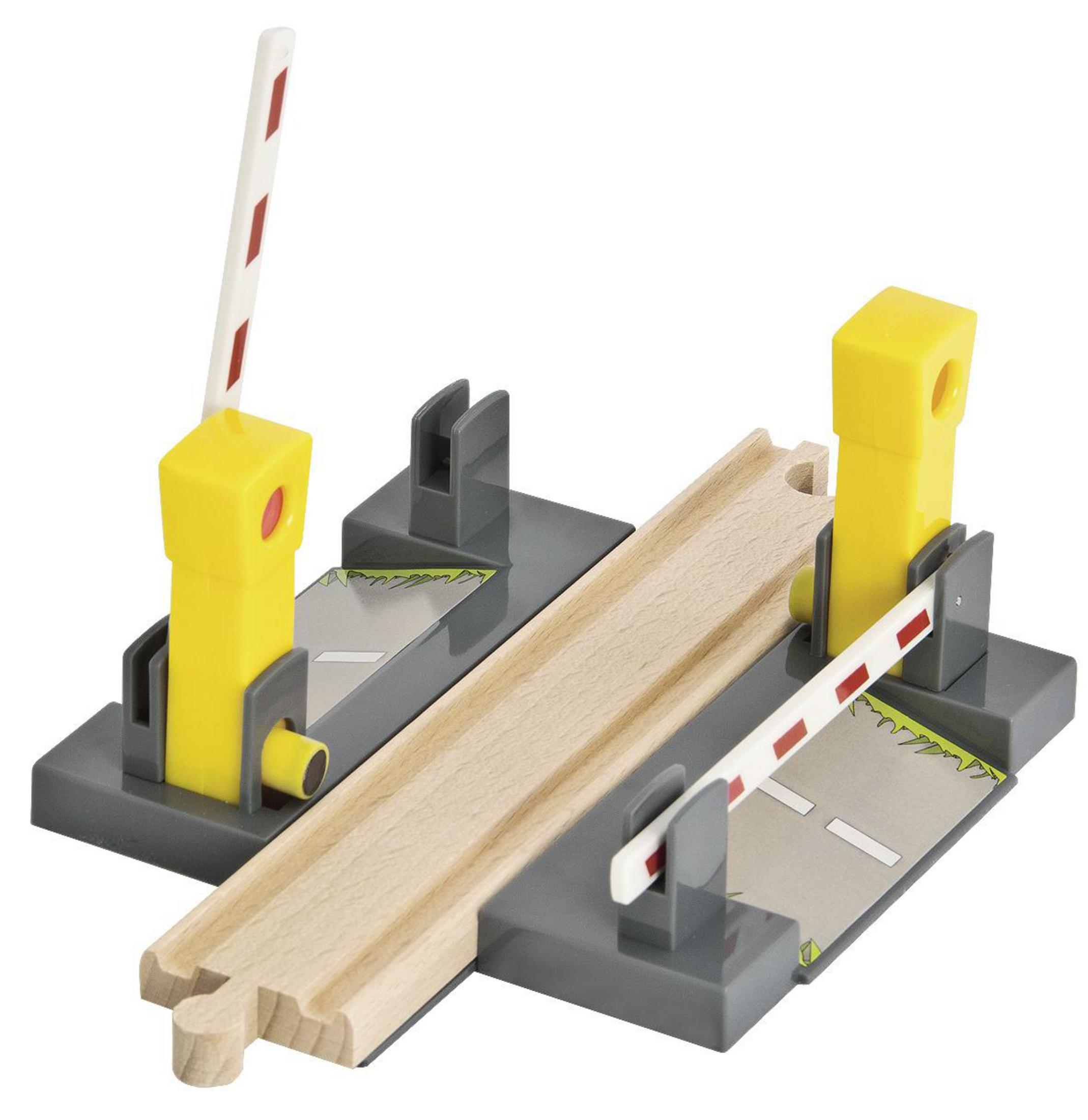 Ein Spielzeug-Zugübergang mit gelben und weißen Schranken. Die Holzstrecke ist in der Mitte.