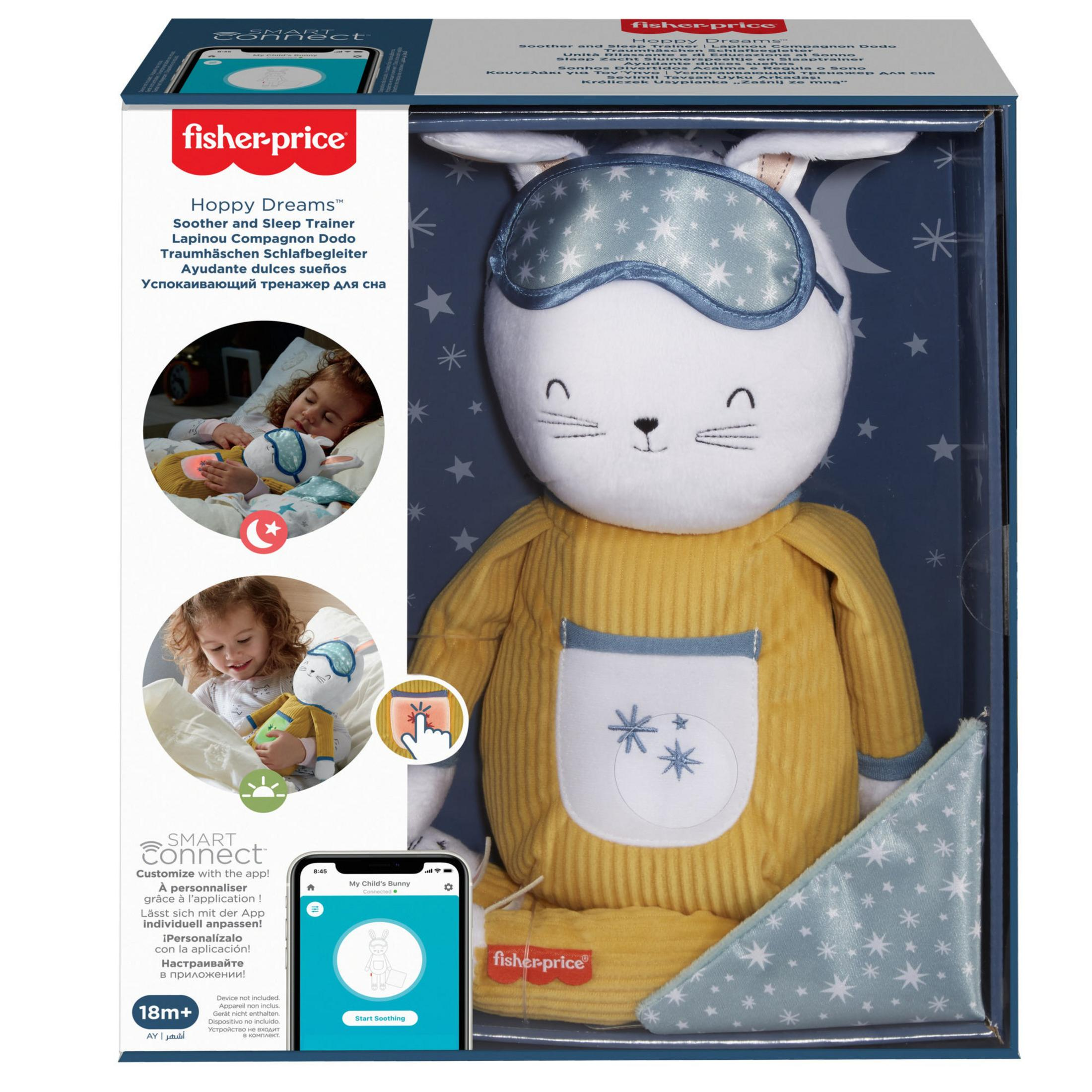 Ein verpacktes Fisher-Price-Spielzeug mit einem weißen Hasen mit Schlafmaske und gelbem Pyjama. Ein Telefon ist im Bild.