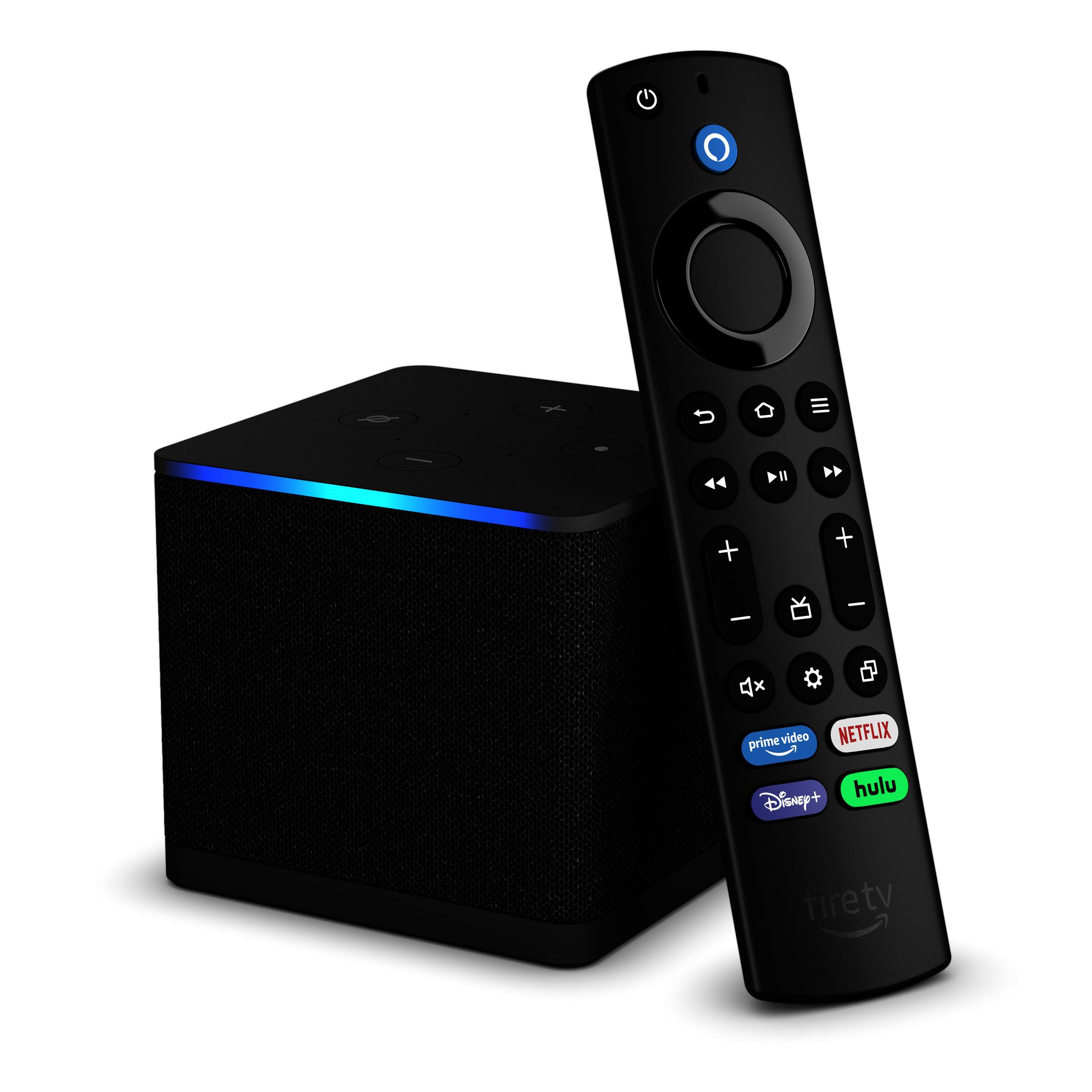 Amazon Fire TV Cube e telecomando neri. Il cubo ha una barra luminosa e il telecomando pulsanti.