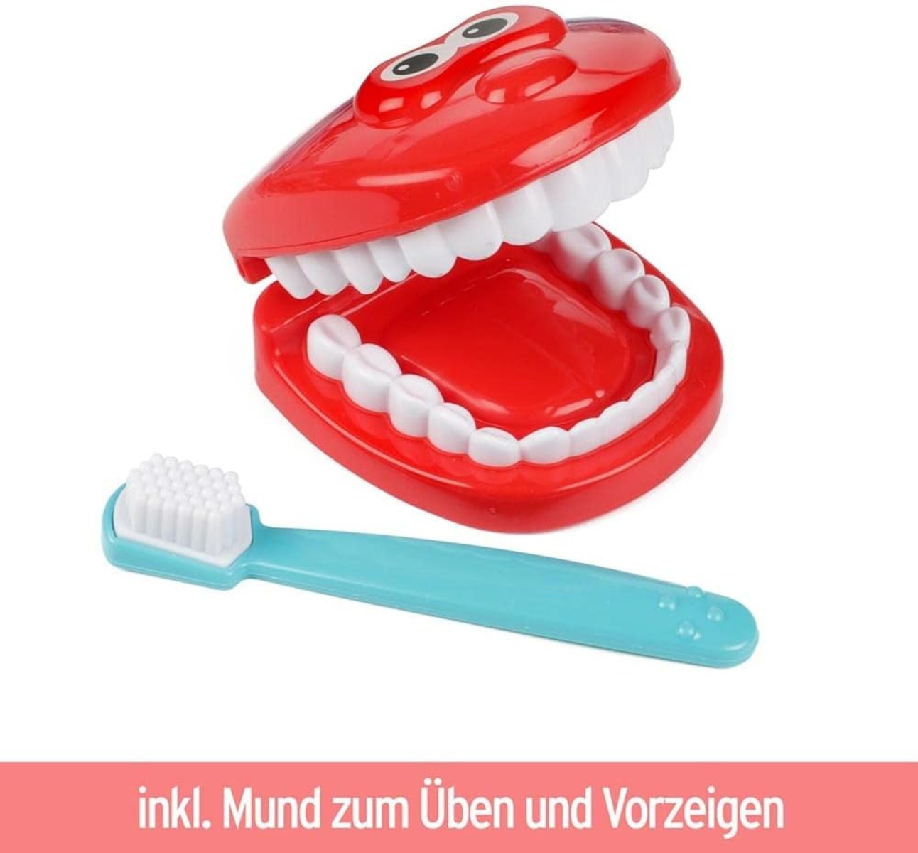 Ein roter Plastikmund mit weißen Zähnen und eine blaue Zahnbürste. Der Mund ist offen.