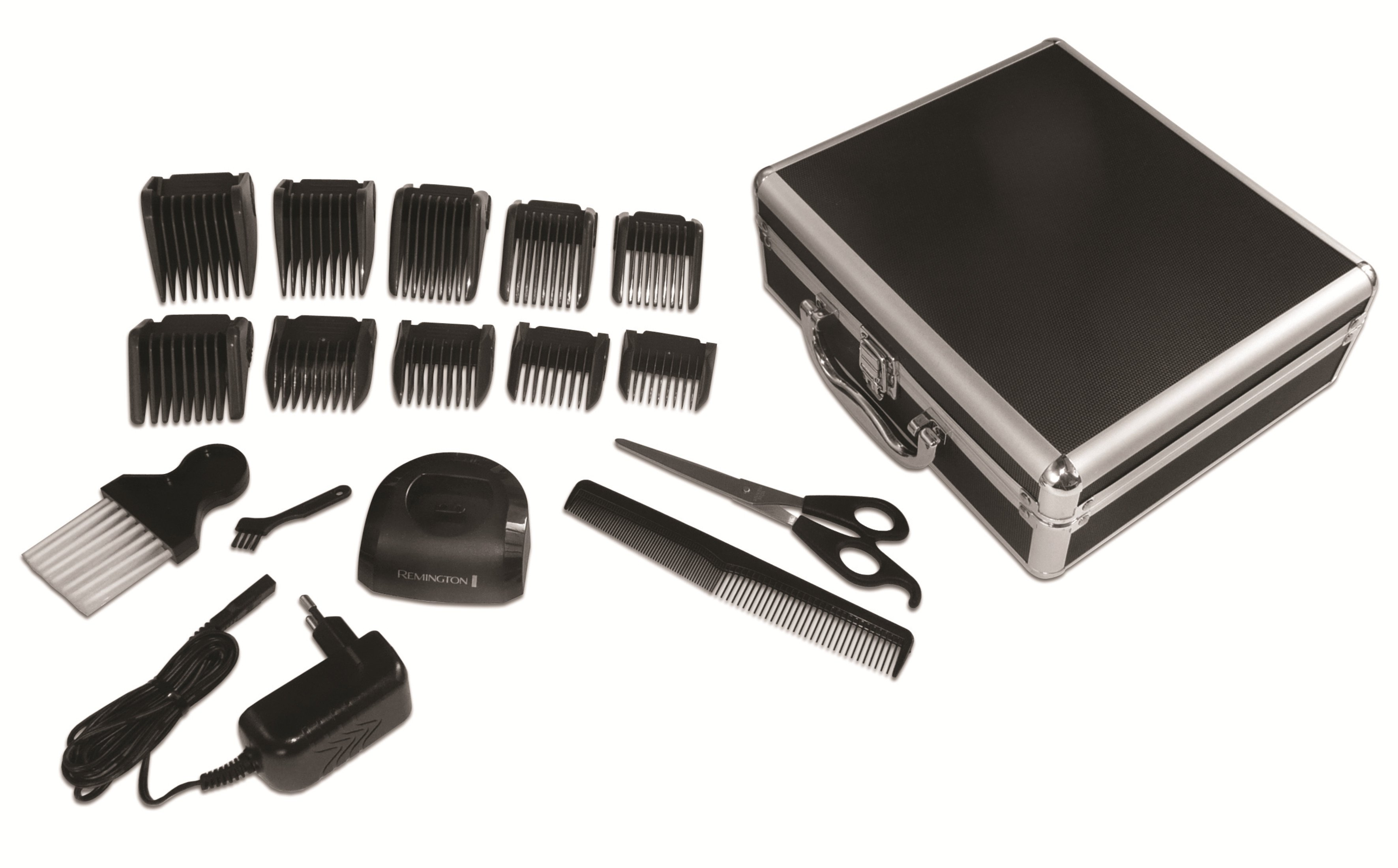Cortapelos y accesorios en un estuche negro. Incluye peines, cuchillas y un cargador.