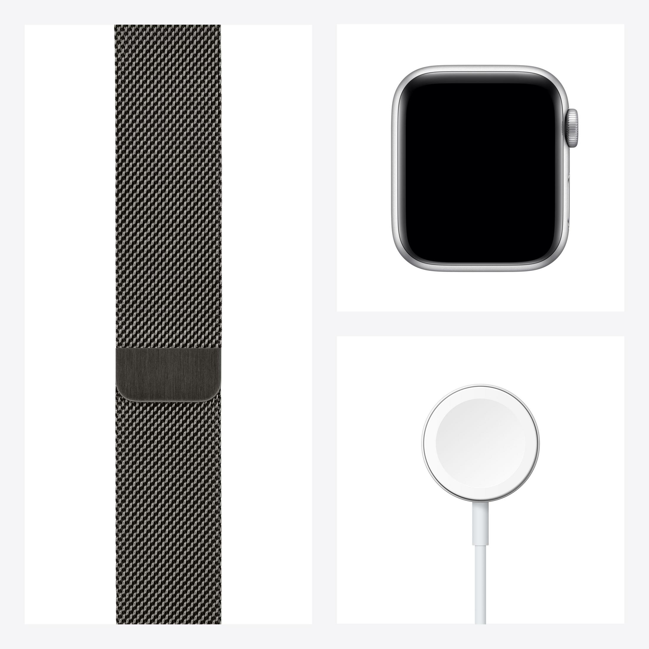 Eine Apple Watch, ein Uhrenarmband und ein Ladegerät auf weißer Oberfläche.