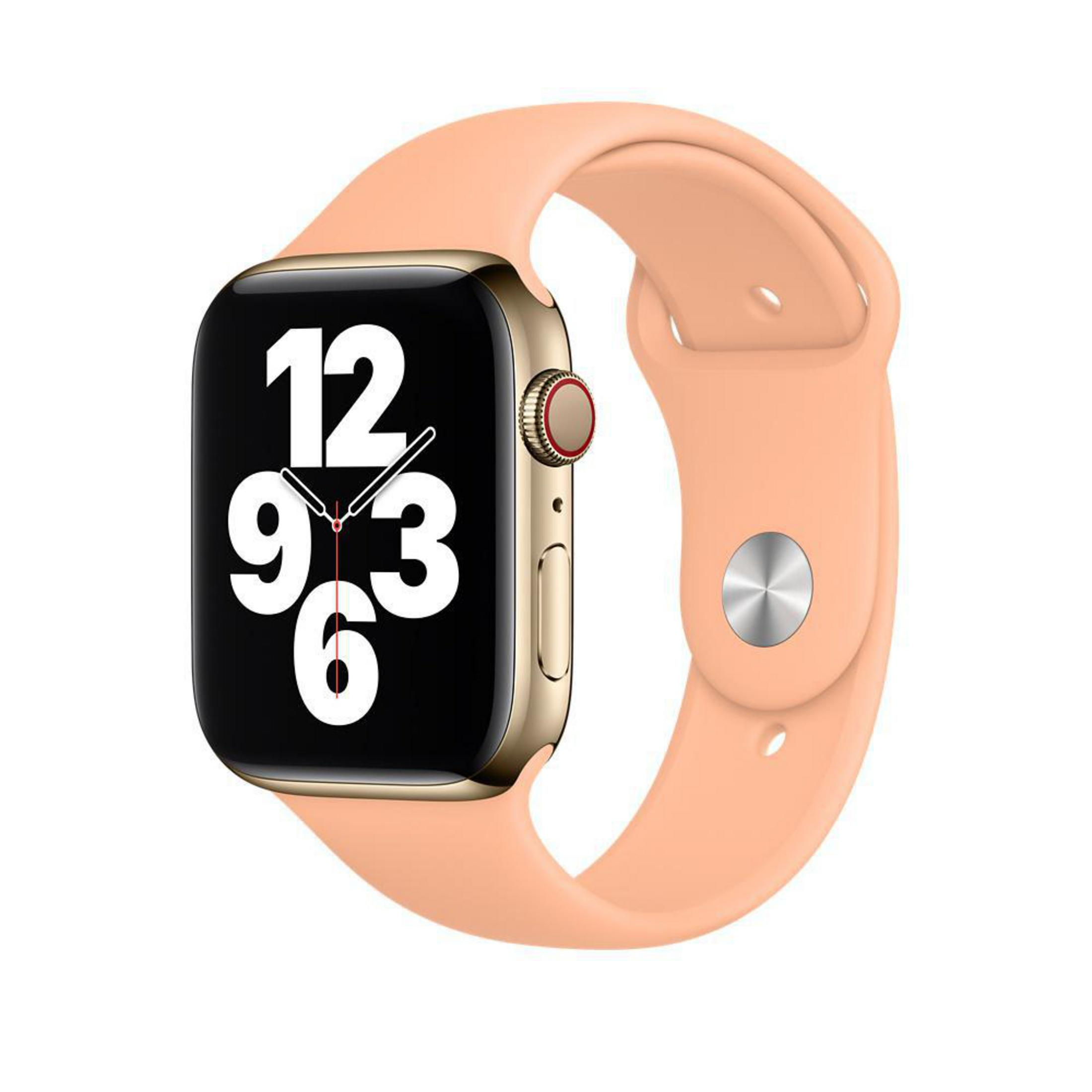 Une Apple Watch avec un bracelet couleur pêche, affichant l'heure et le cadran.
