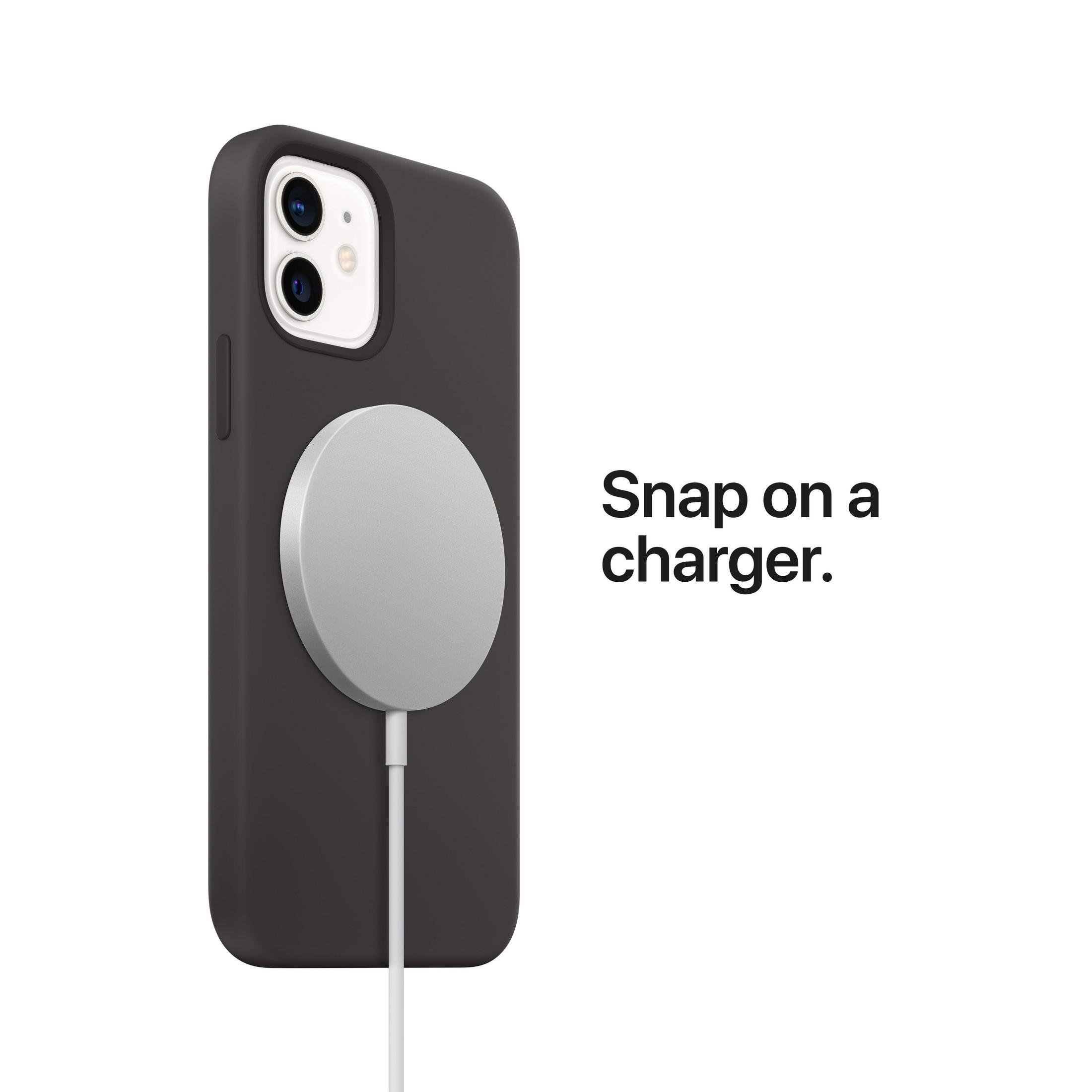 Telefon w czarnym etui z dołączoną srebrną ładowarką magnetyczną na białym tle.