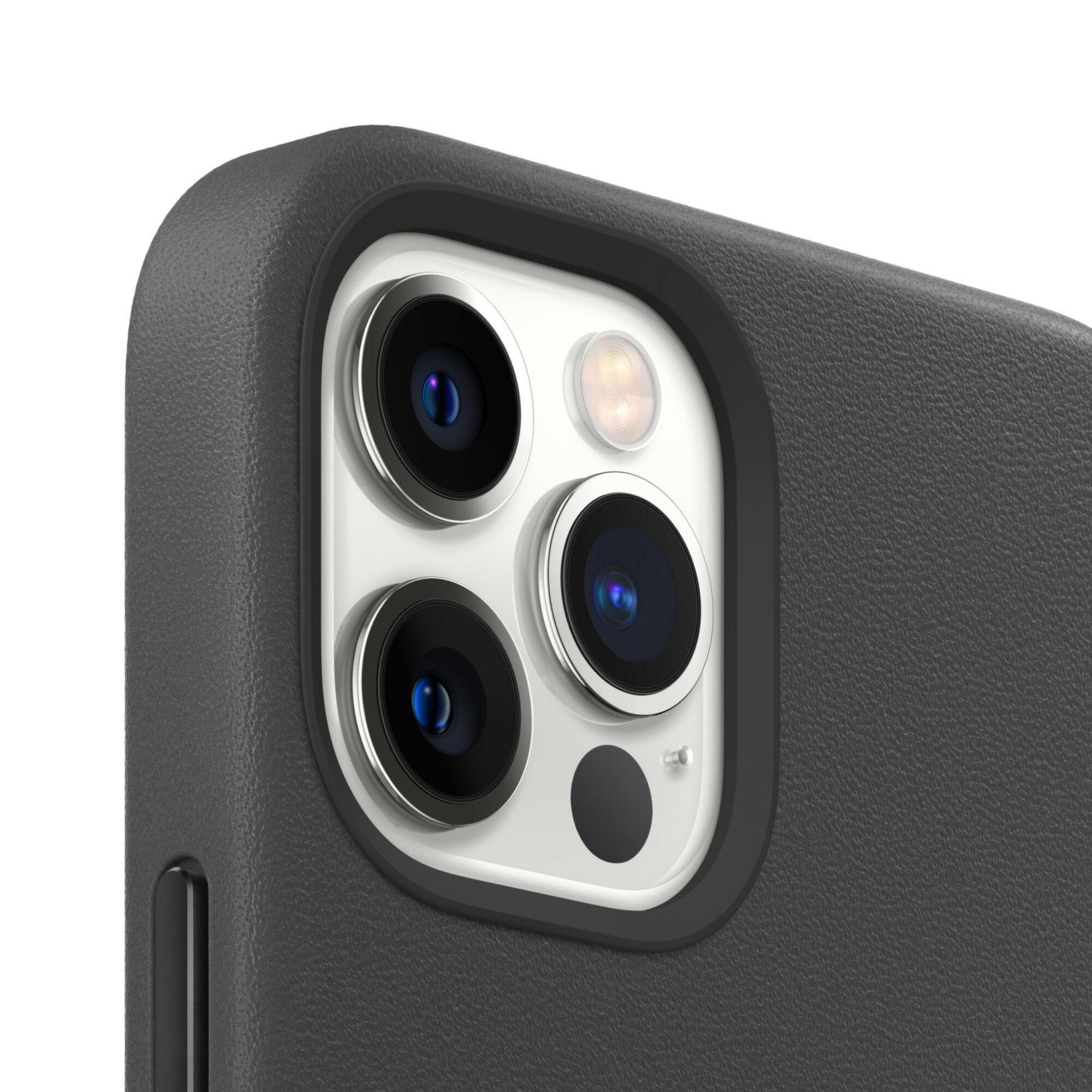 Close-up of a phone's camera module with three lenses and flash.
