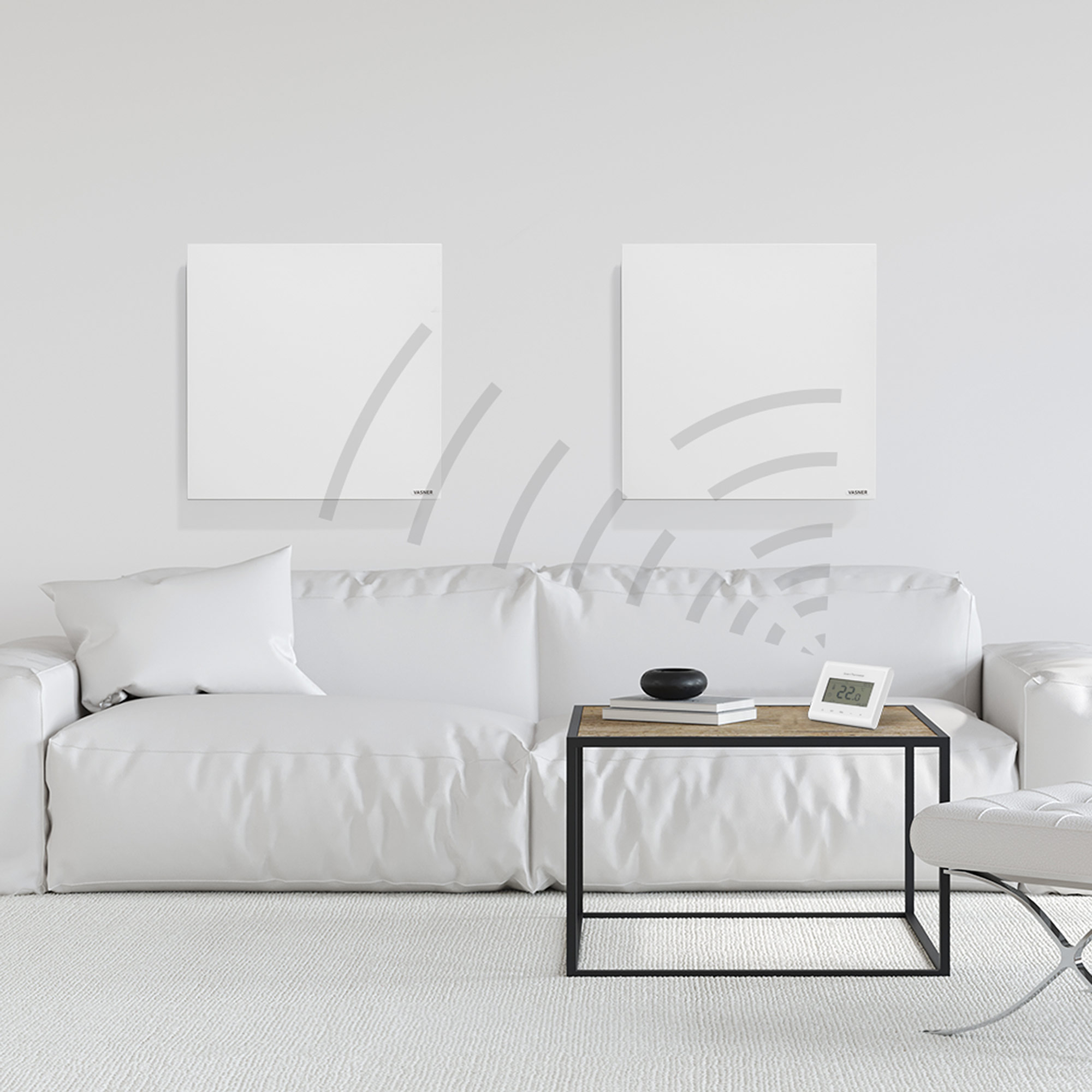 Zwei weiße Wandheizungen und ein Thermostat auf einem Tisch vor einem weißen Sofa.