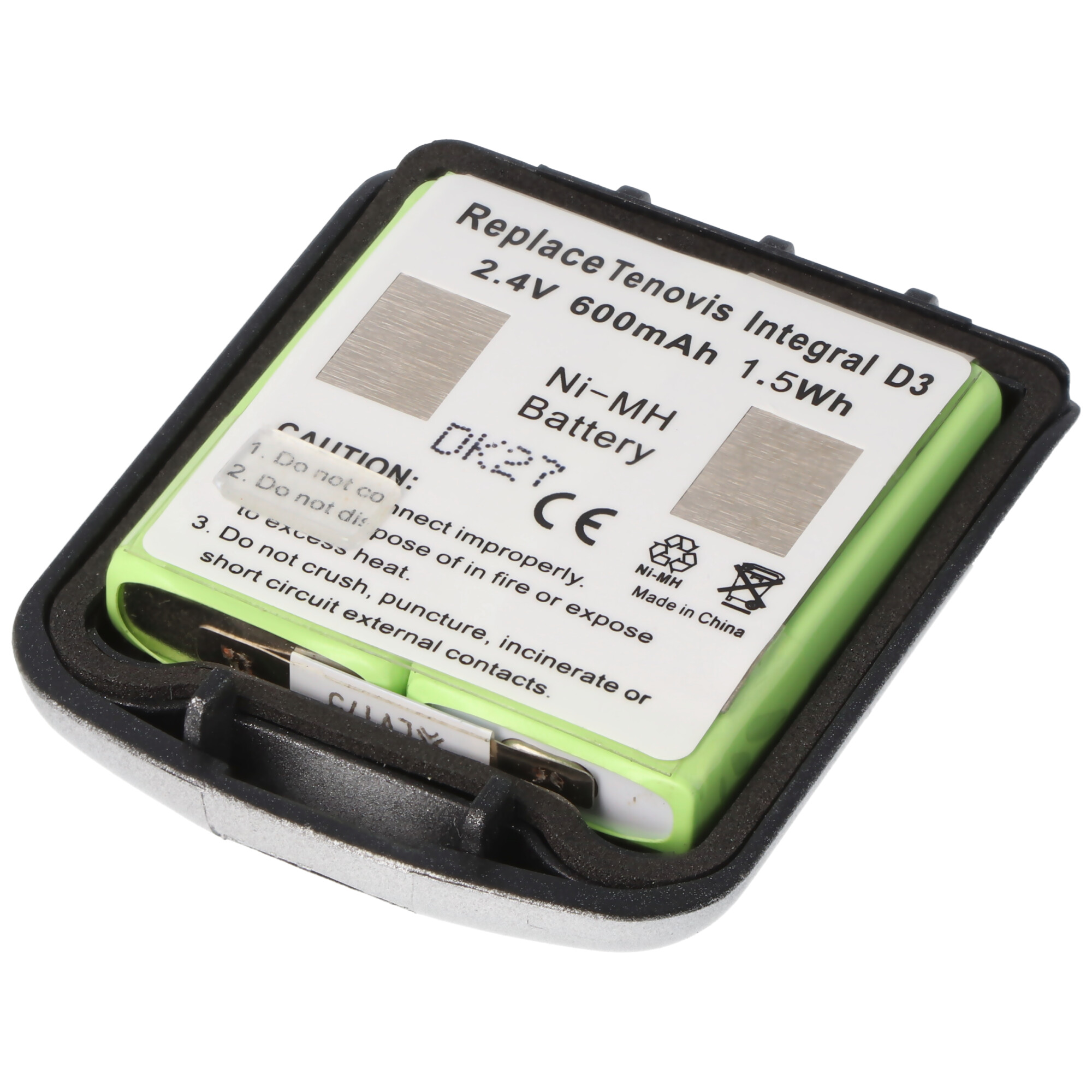 Ein offenes Batteriefach mit einer grünen Batterie darin. Text auf der Batterie ist sichtbar.