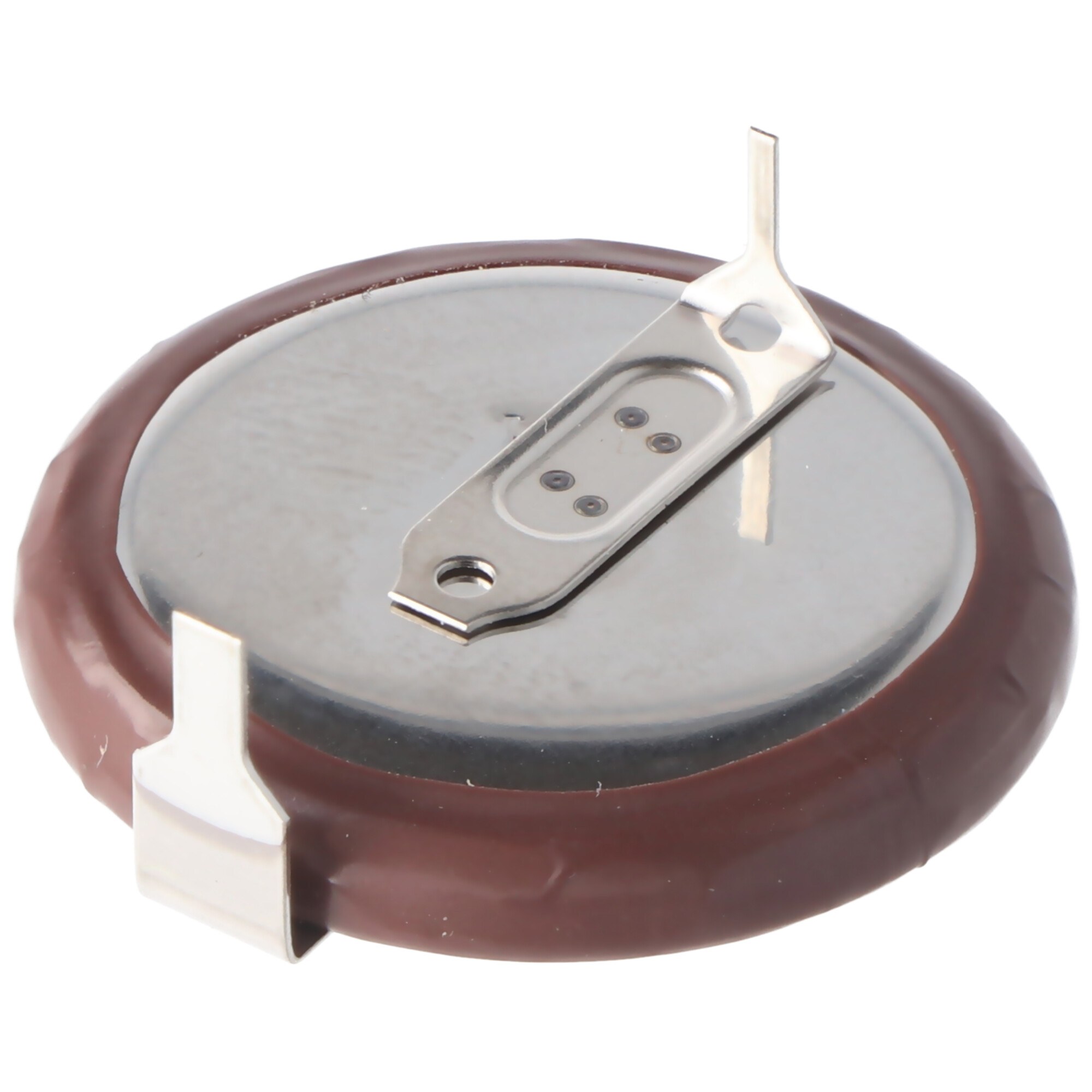 Eine kreisförmige braune Batterie mit einem Metallclip oben.