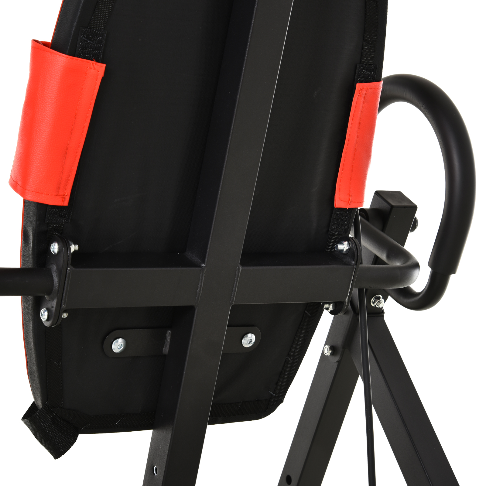 Primer plano de una mesa de inversión: cojín negro con soportes rojos y un asa curva.