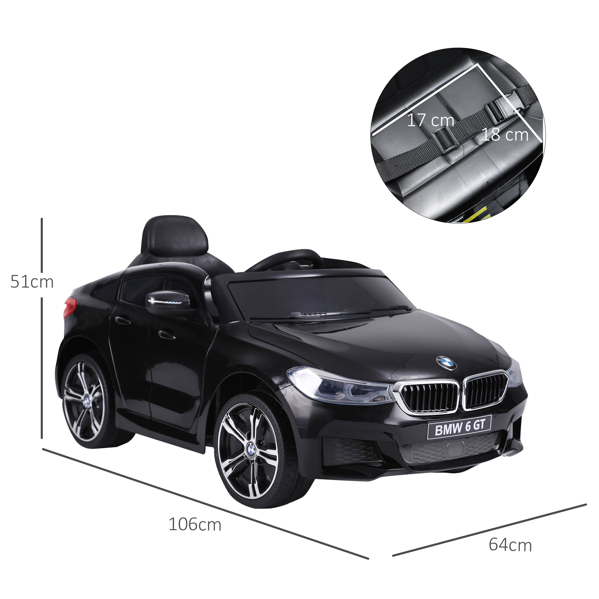Coche de juguete negro con ruedas blancas. Tiene las palabras BMW 6 GT en la parte trasera. El coche es negro.