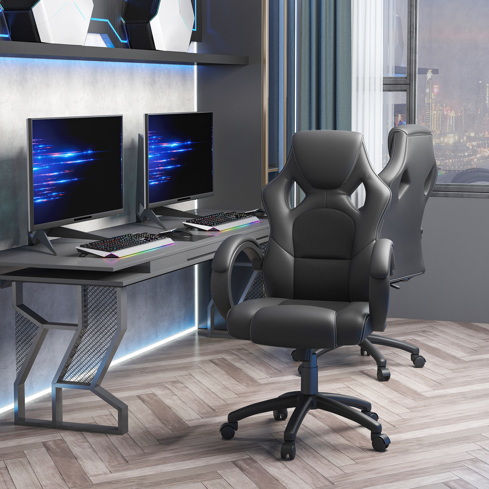Un'impostazione di gioco con due monitor, tastiere, una sedia nera e una scrivania. È presente anche una seconda sedia.