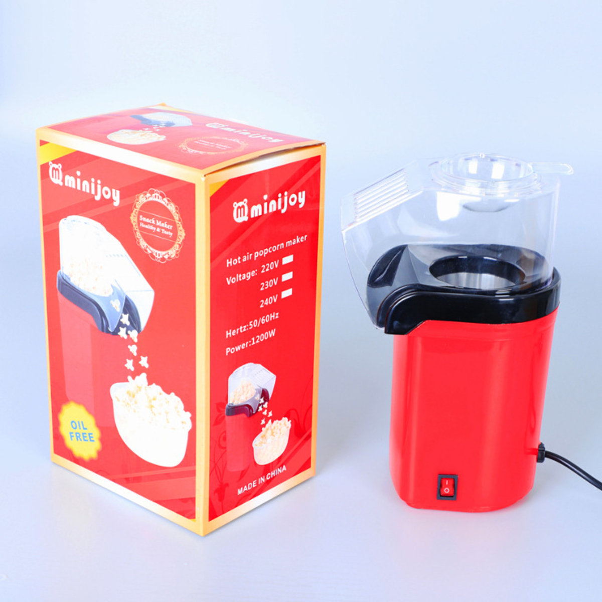 Roter und weißer miniJoy Popcorn-Maker mit Karton, der Popcorn und Maschine zeigt.