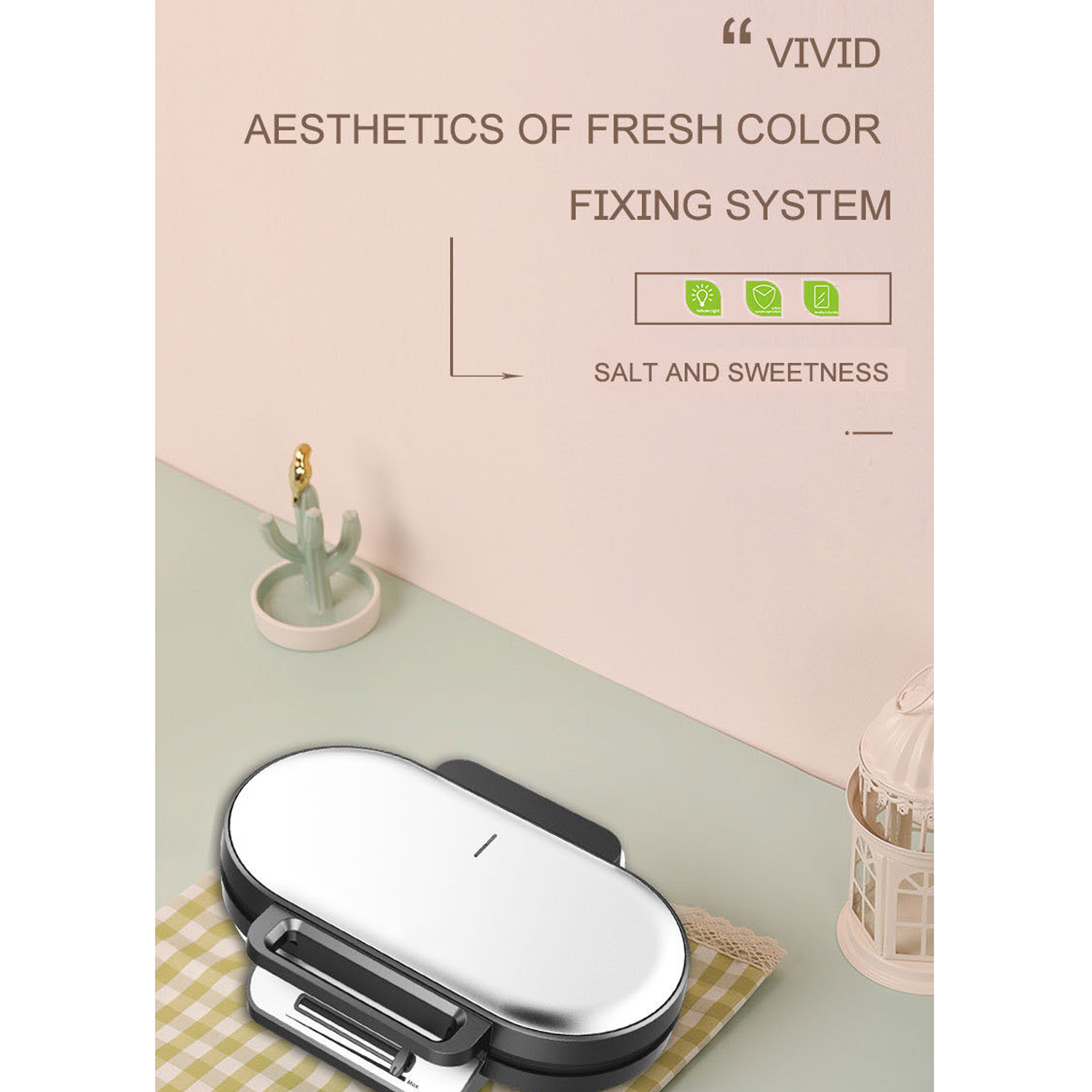 Silber-schwarzer Sandwichmaker auf grüner Oberfläche. Text über Ästhetik und Fixiersystem.