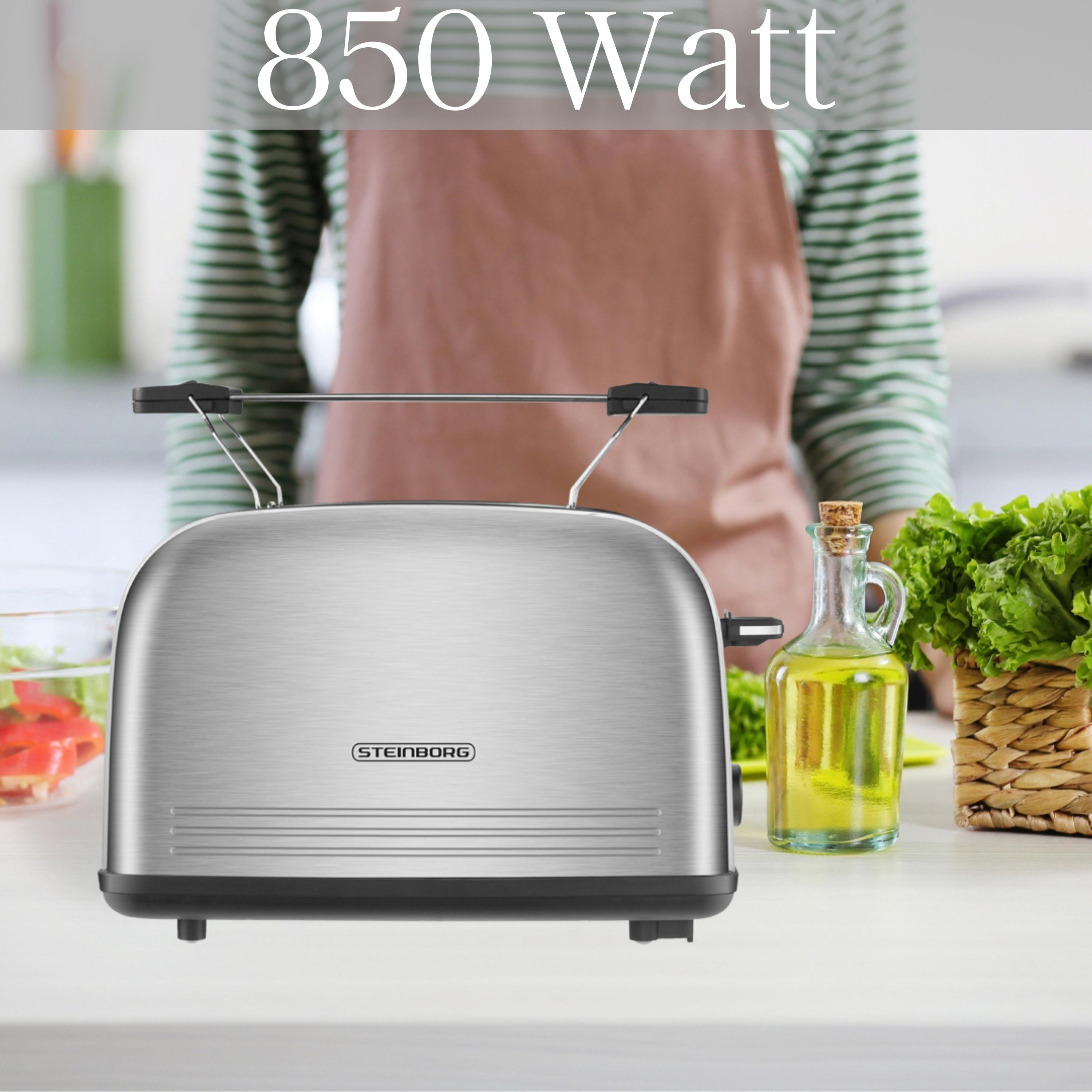 Ein Toaster aus Edelstahl auf einer weißen Arbeitsplatte, mit einer Person im Hintergrund.