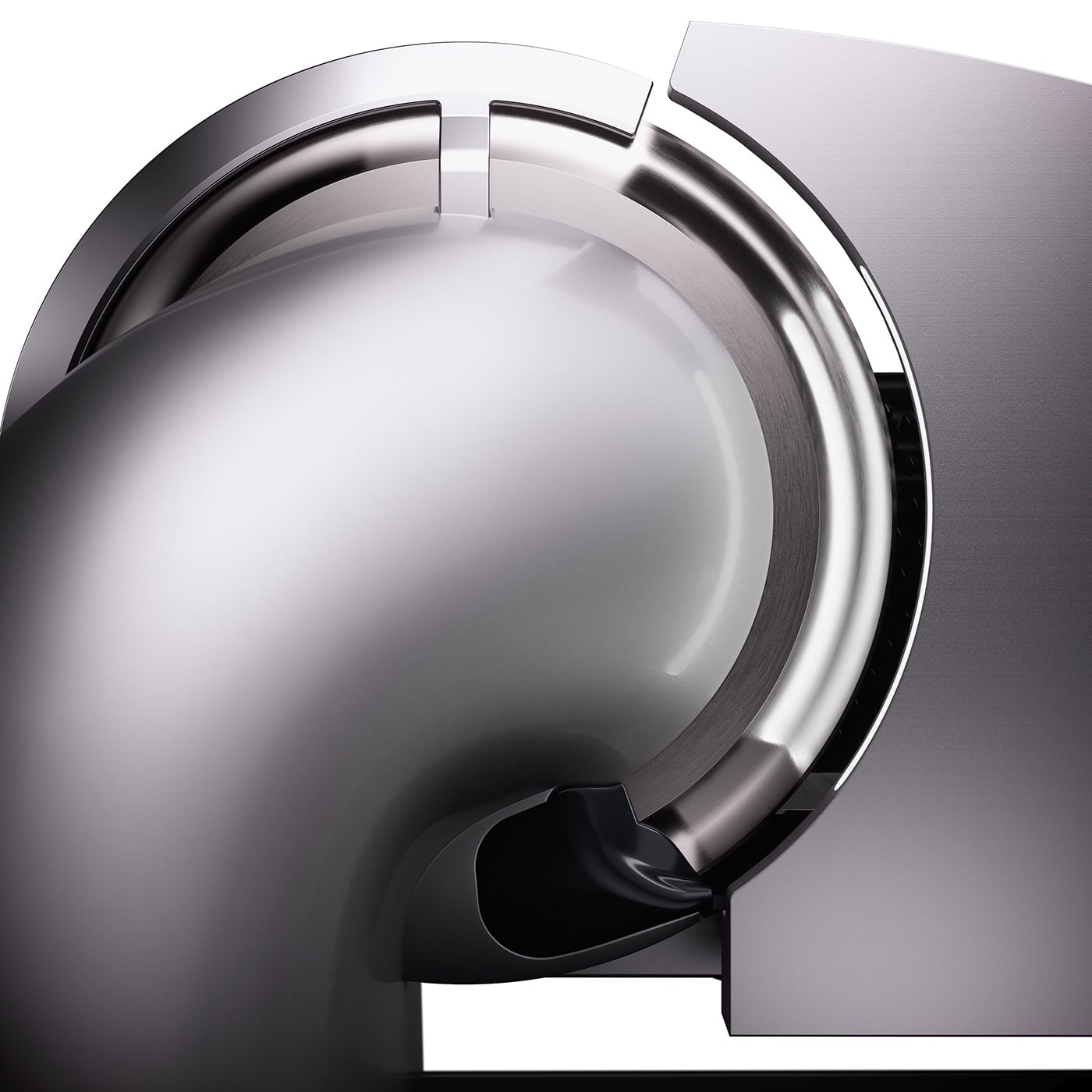 Primo piano di un oggetto metallico con design circolare e superfici curve sovrapposte.
