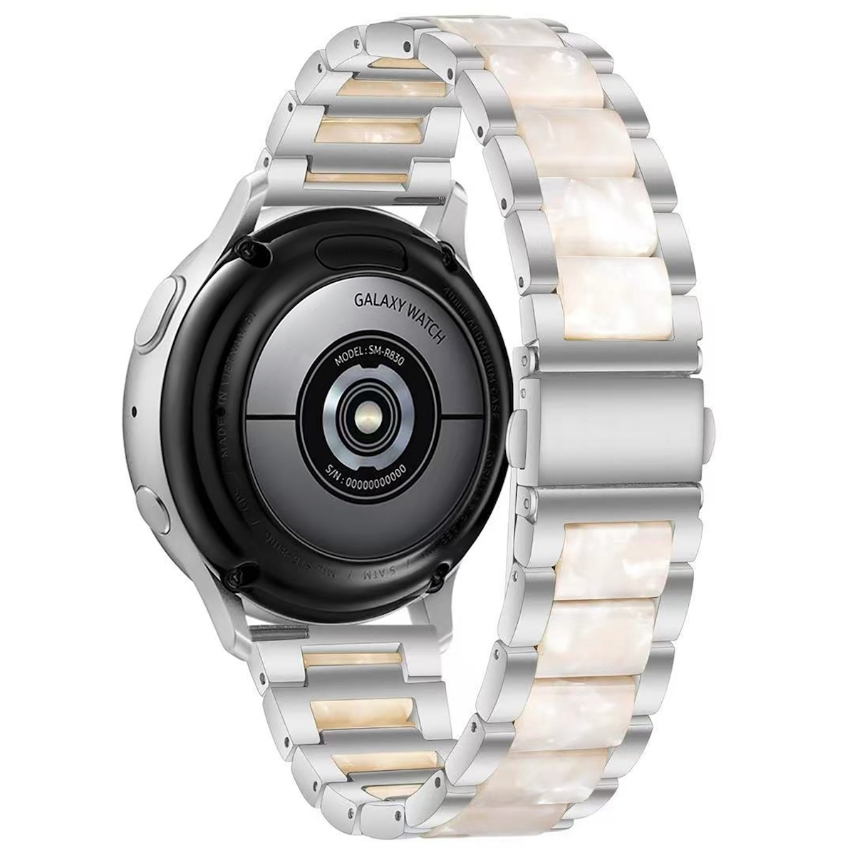 Silberne Uhr mit weißem Armband. Die Uhr liegt auf dem Rücken. Das Armband ist sichtbar.