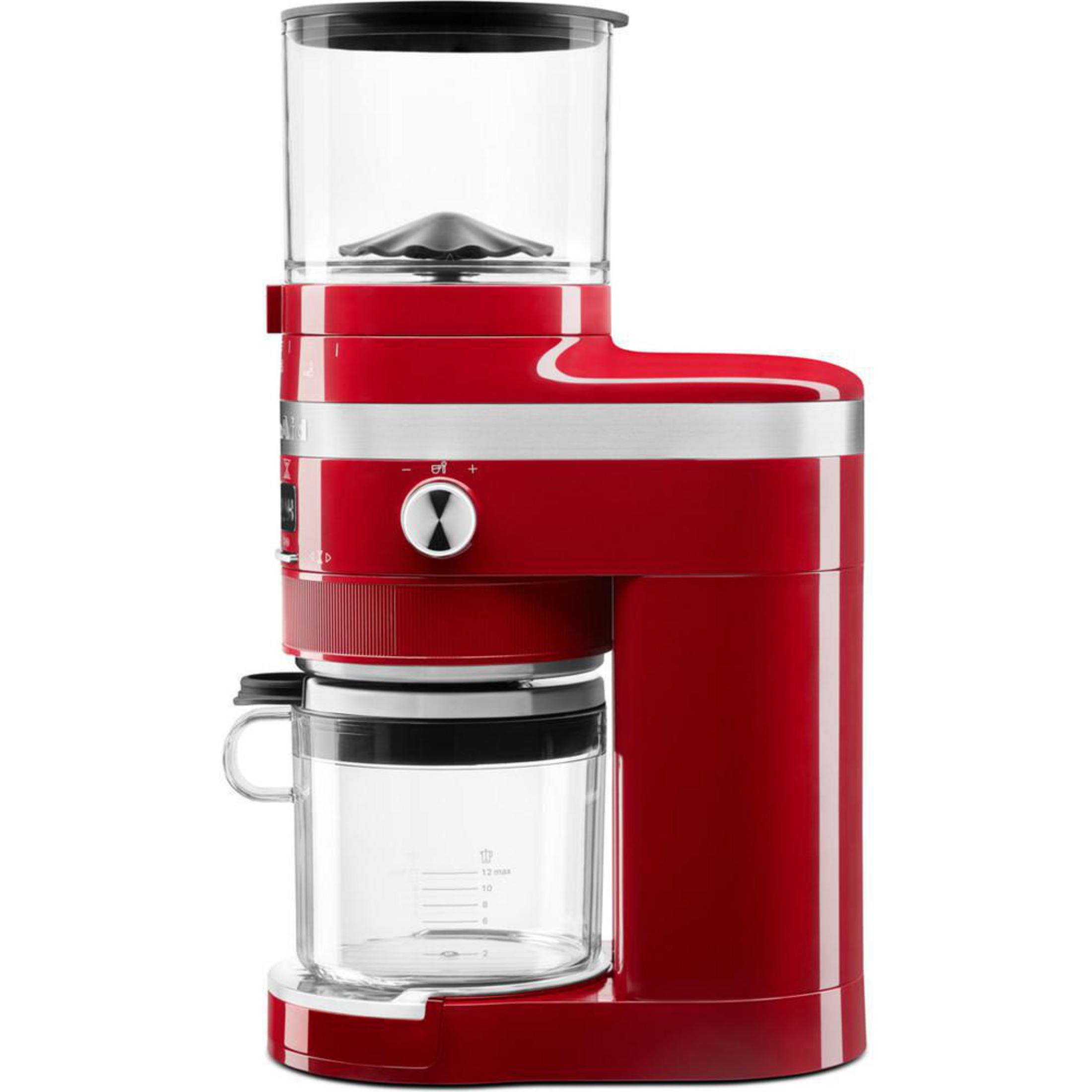 Eine rote Kaffeemühle mit einem Glasbehälter und einem schwarzen Deckel. Es hat einen Ein/Aus-Knopf.
